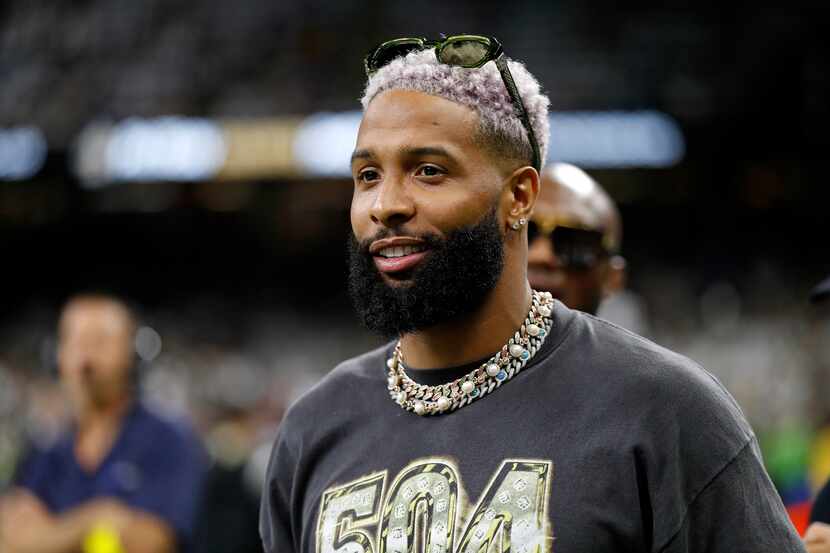 Odell Beckham Jr. is seen on the sidelines before an NFL football game between the New...