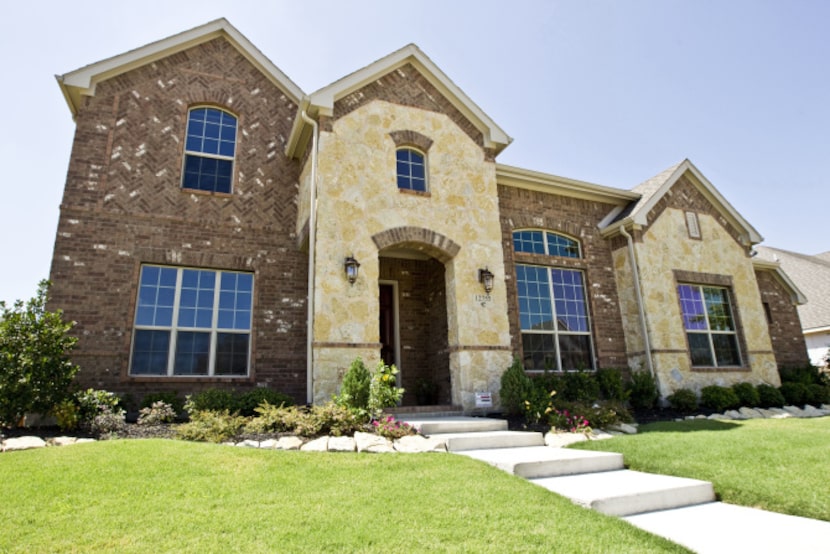 Coventry Homes built Curtis and Anna Kelly's residence in Frisco. A two-story house is...