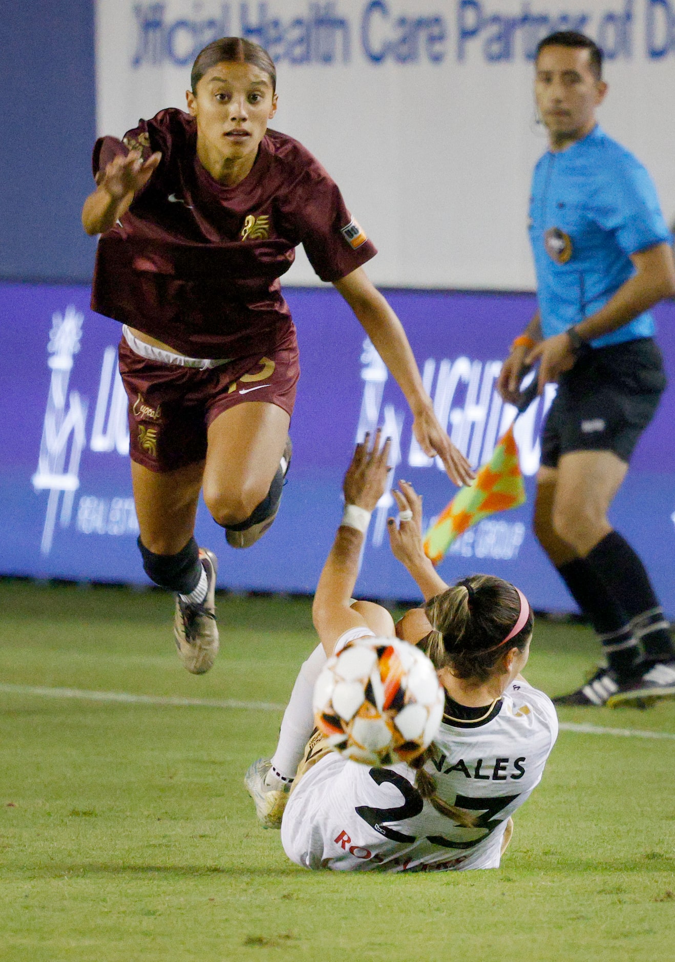 Dallas Trinity midfielder Samantha Meza jumps over Spokane Zephyr midfielder  Marley Canales...