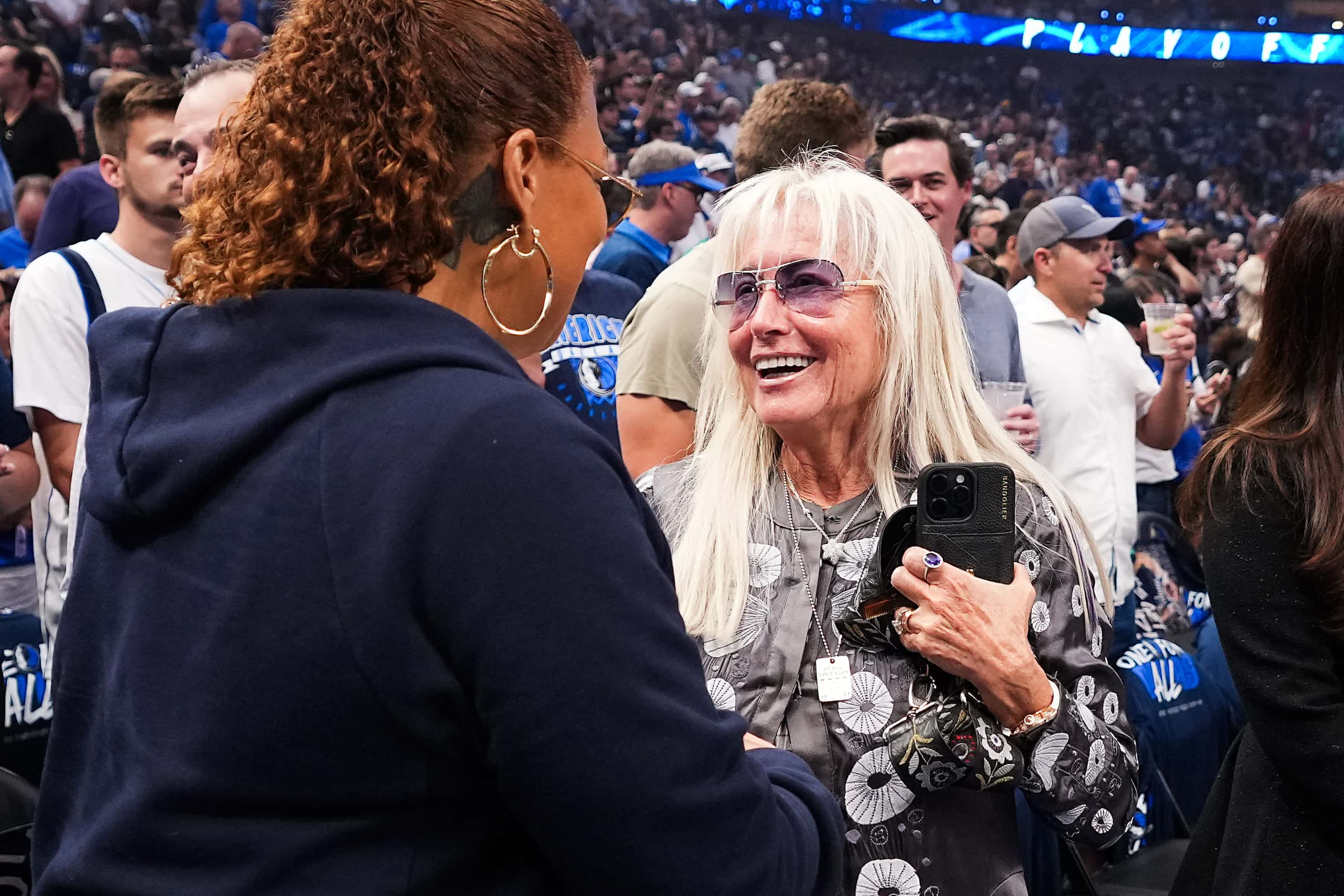 Miriam Adelson talks with Queen Latifah before Game 3 of the NBA basketball Western...