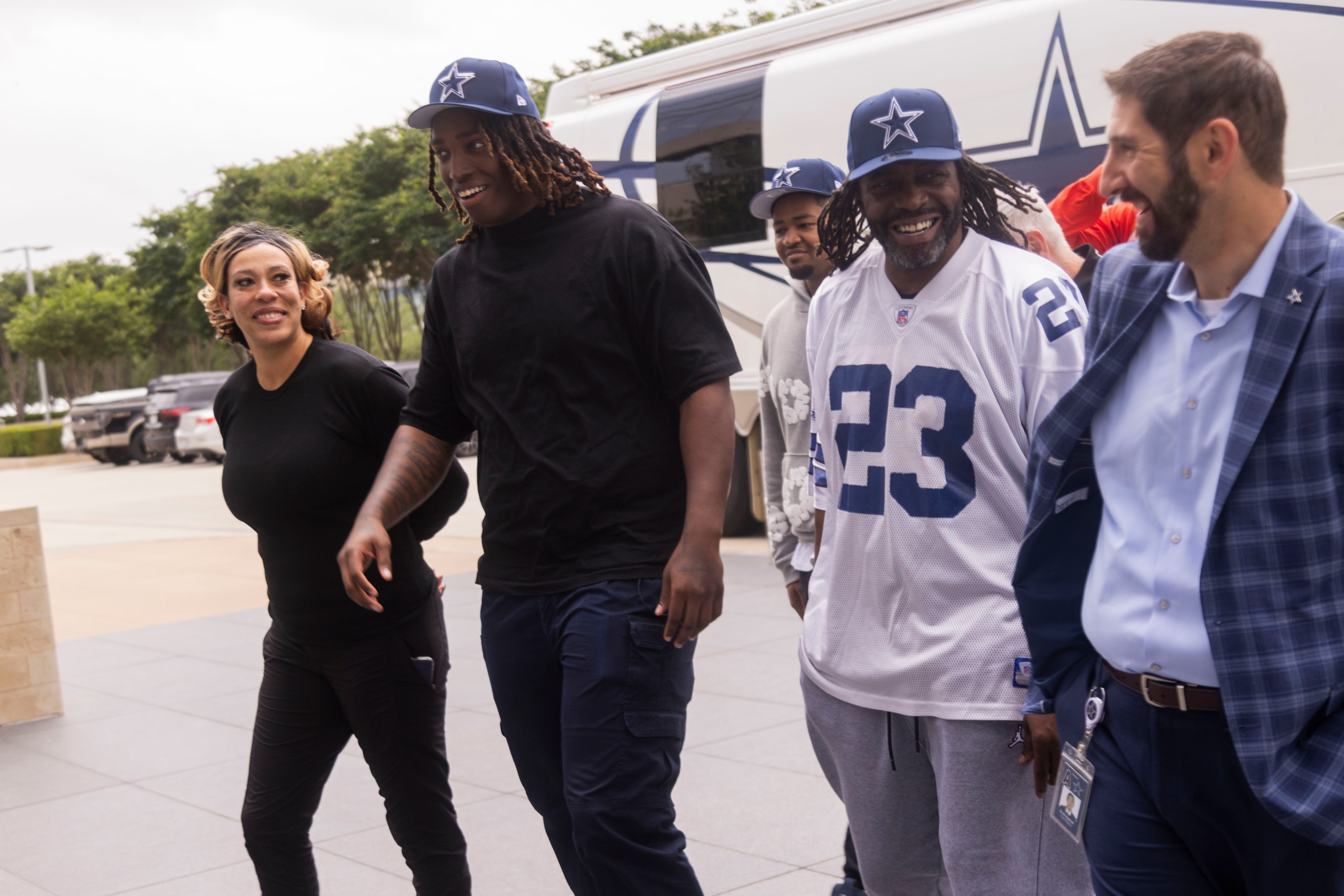 The new Dallas Cowboys left tackle Tyler Guyton, center left, walks with mom Makenzie...