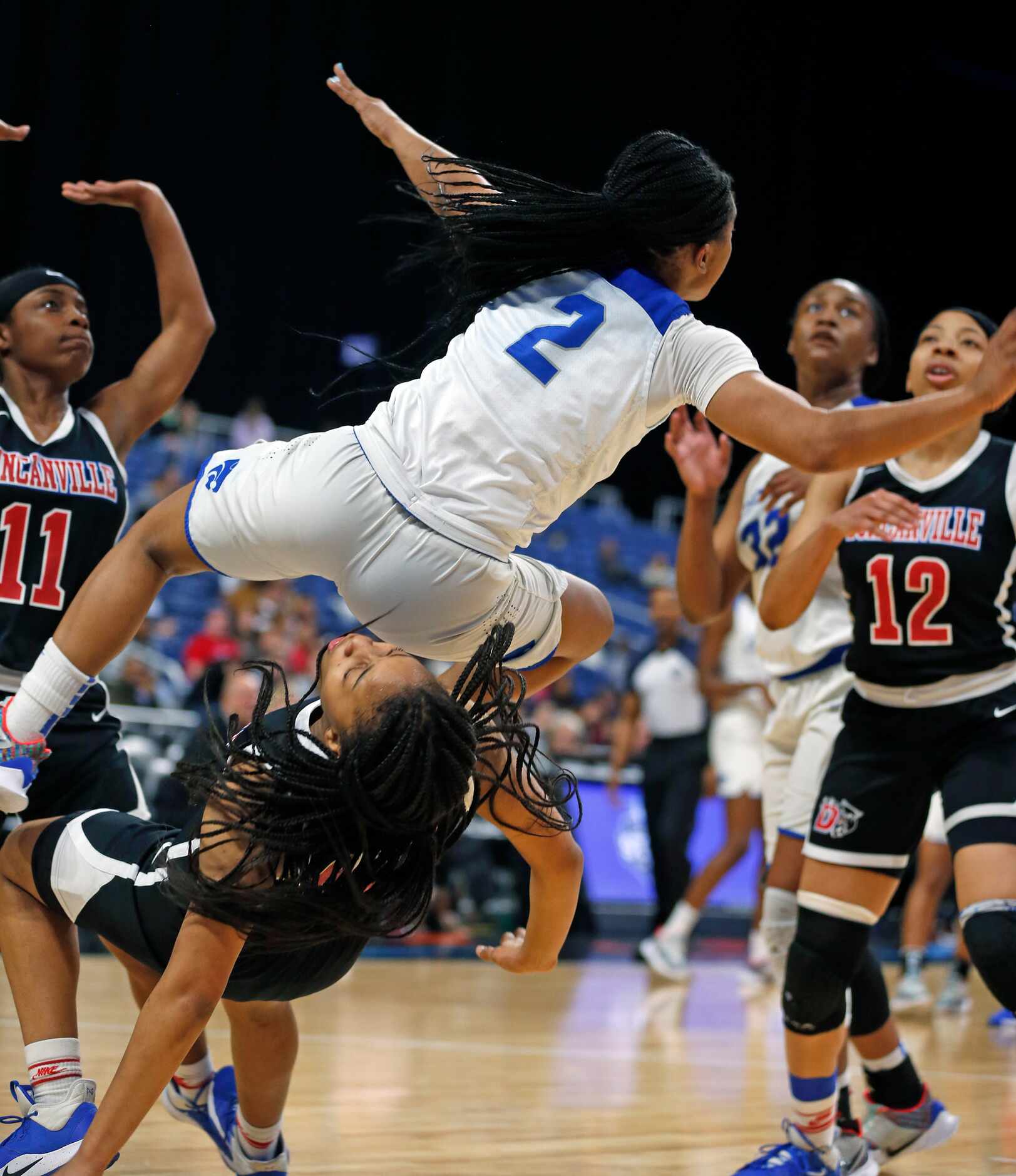 Duncanville guard Hope LeMelle #00 takes a charge from Cypress Creek guard Marcayla Wortham...