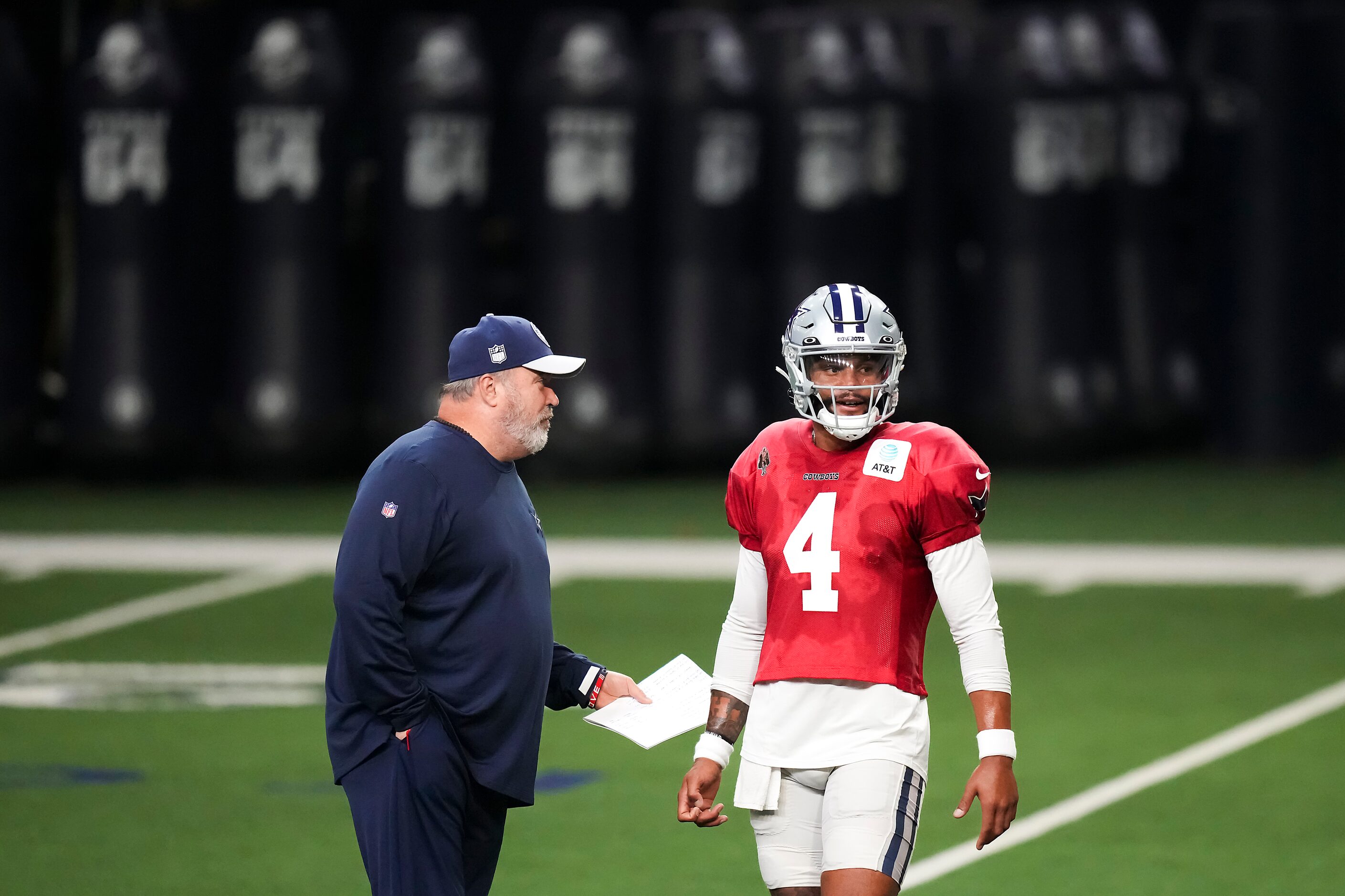 Dallas Cowboys quarterback Dak Prescott (4) talks with head coach Mike McCarthy during the...