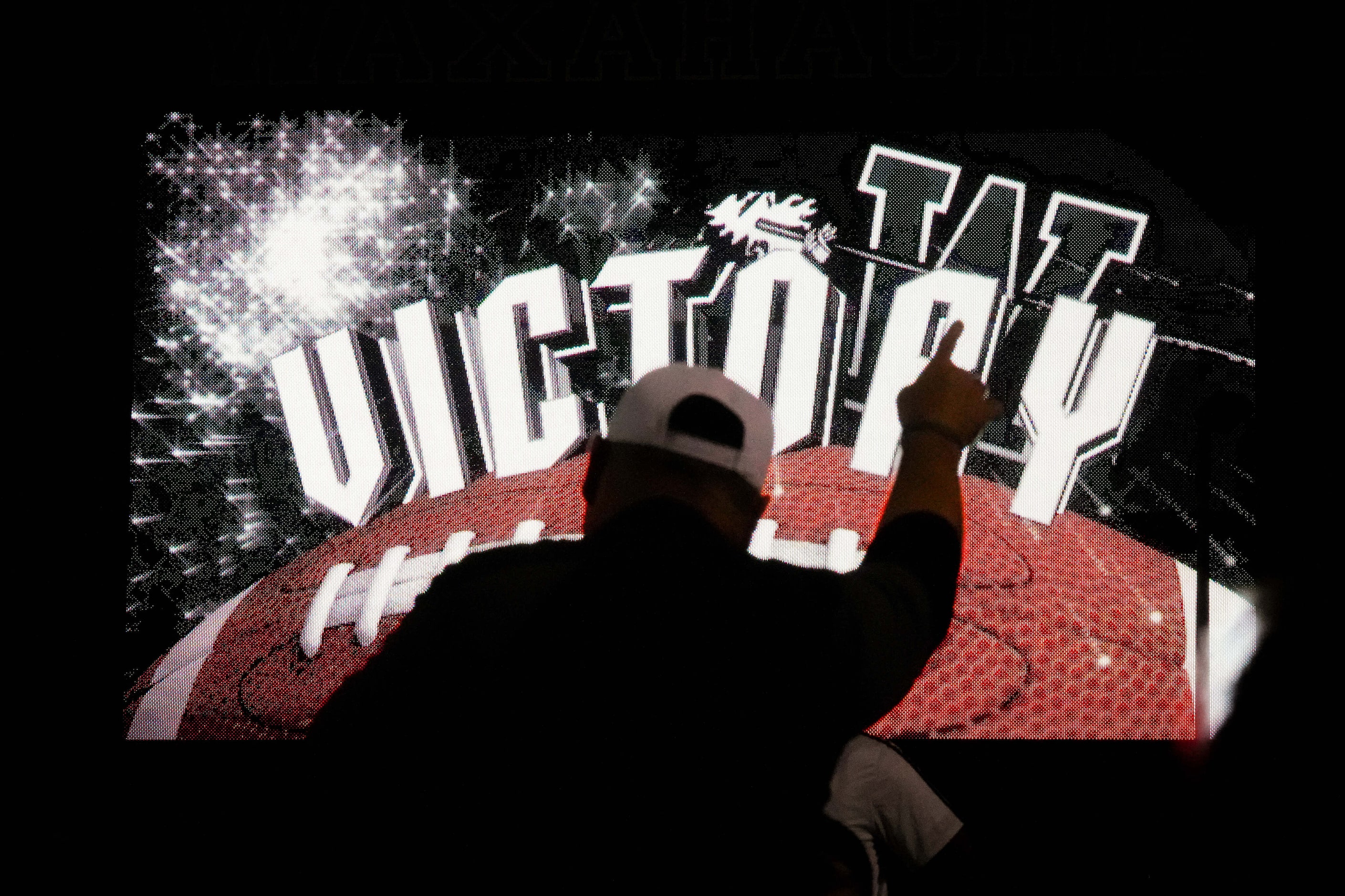 Waxahachie head coach Shane Tolleson talks to his team on the field after 31-20 victory over...