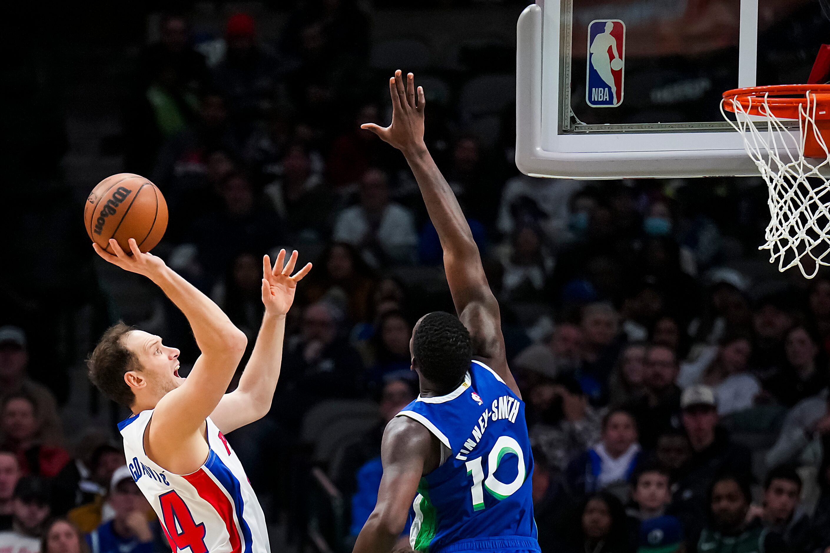 Detroit Pistons forward Bojan Bogdanovic (44) scores over Dallas Mavericks forward Dorian...