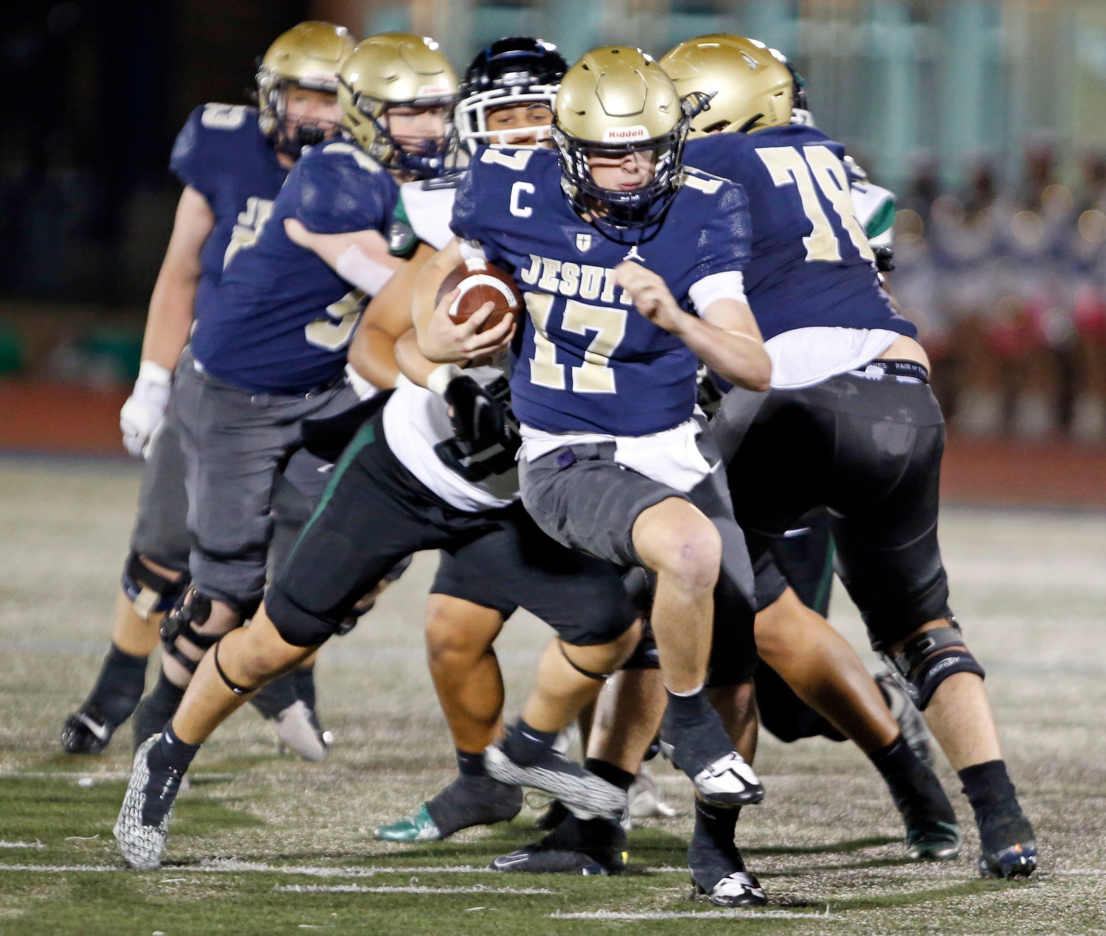 Jesit QB Charlie Schmidt (17) scrambles for s first down during the first half of a high...