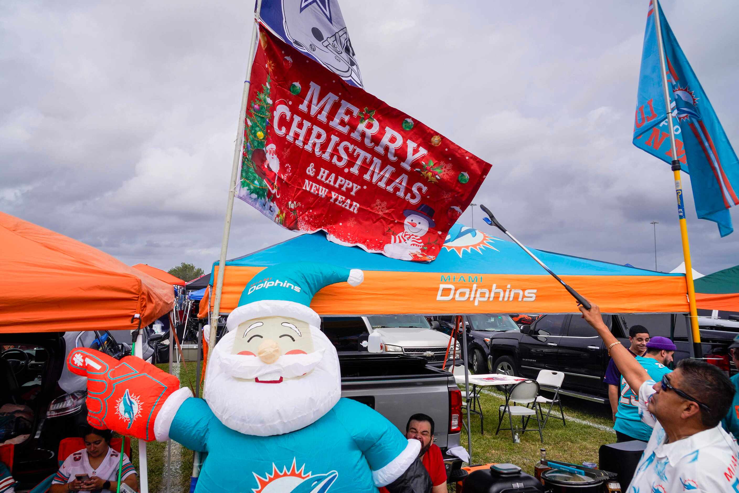 Fans tailgate before an NFL football game between the Dallas Cowboys and the Miami Dolphins...