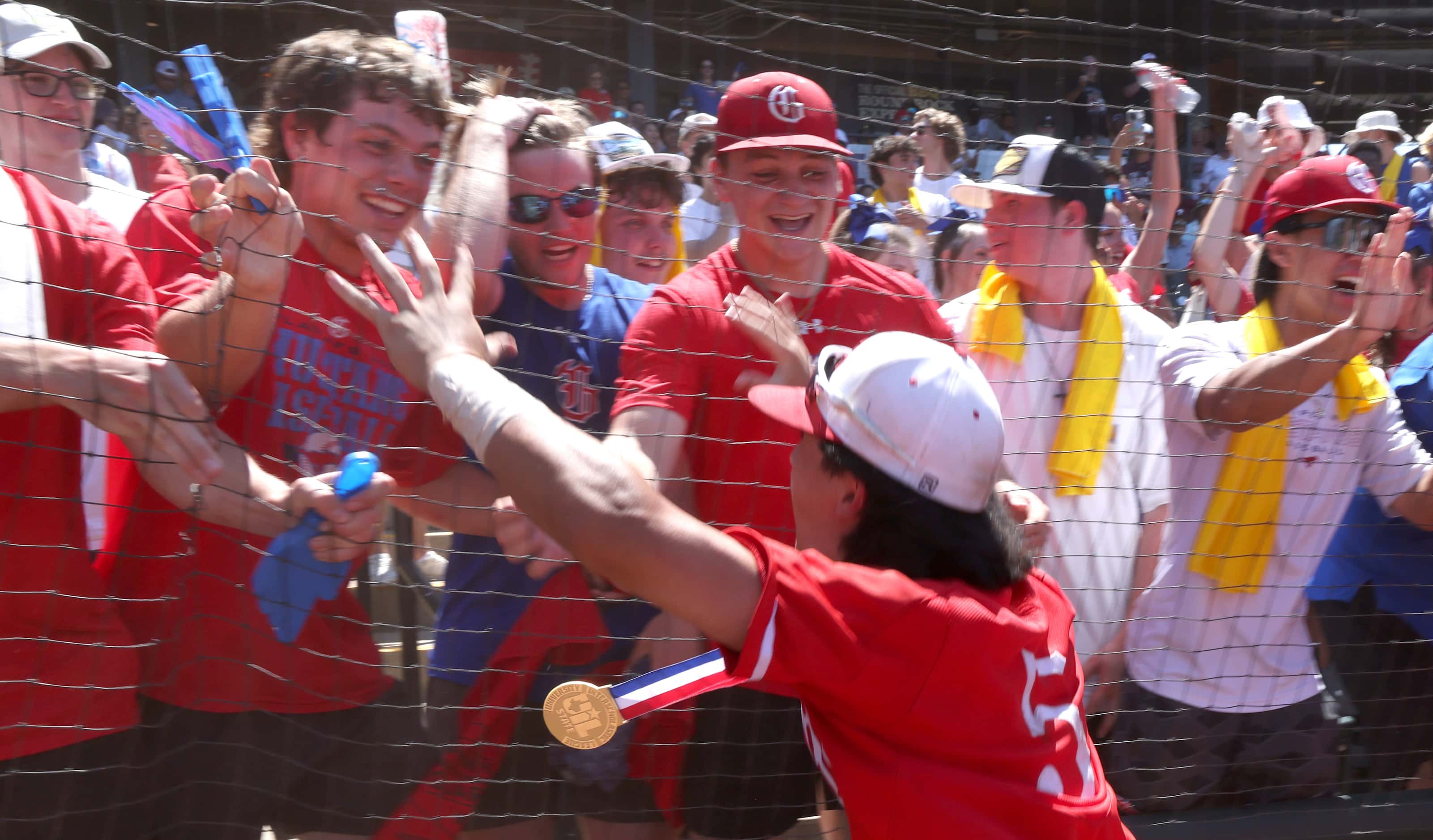 Grapevine's Collin Park (5) celebrates with fans following the Mustangs' 6-5 victory over...
