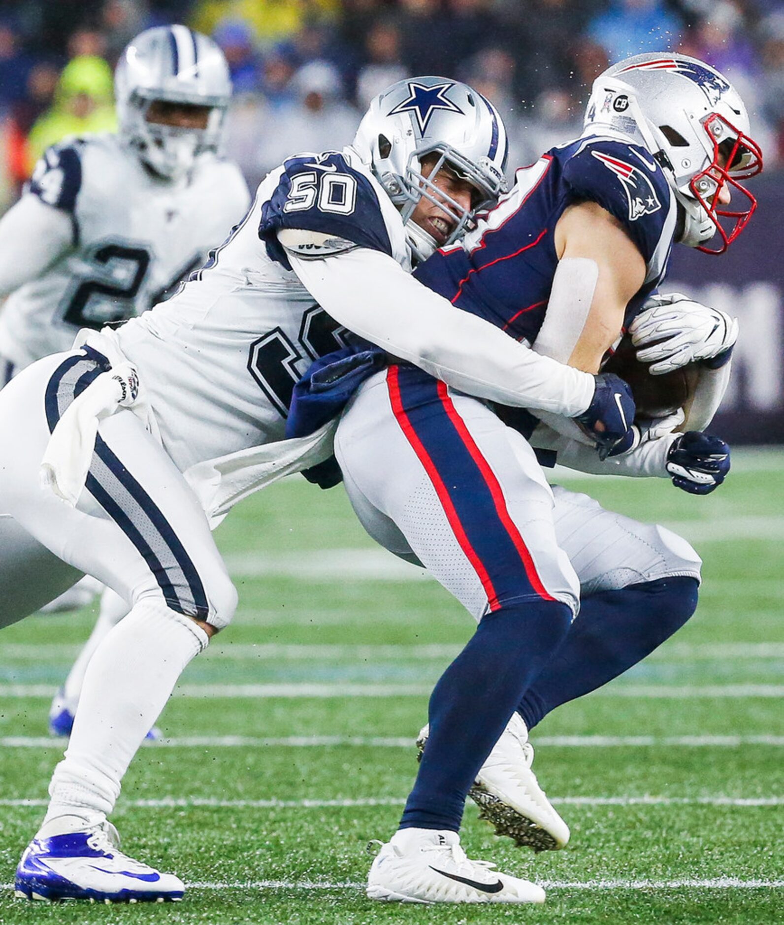 Dallas Cowboys outside linebacker Sean Lee (50) takes down New England Patriots running back...