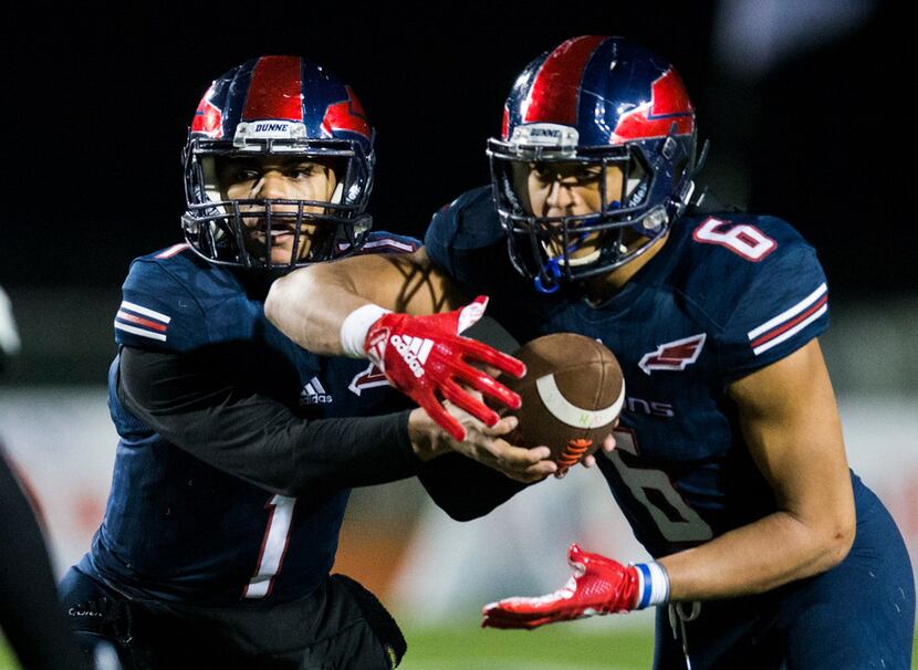 Bishop Dunne quarterback Simeon Evans (1) hands off the ball to offensive back Jaden Hullaby...