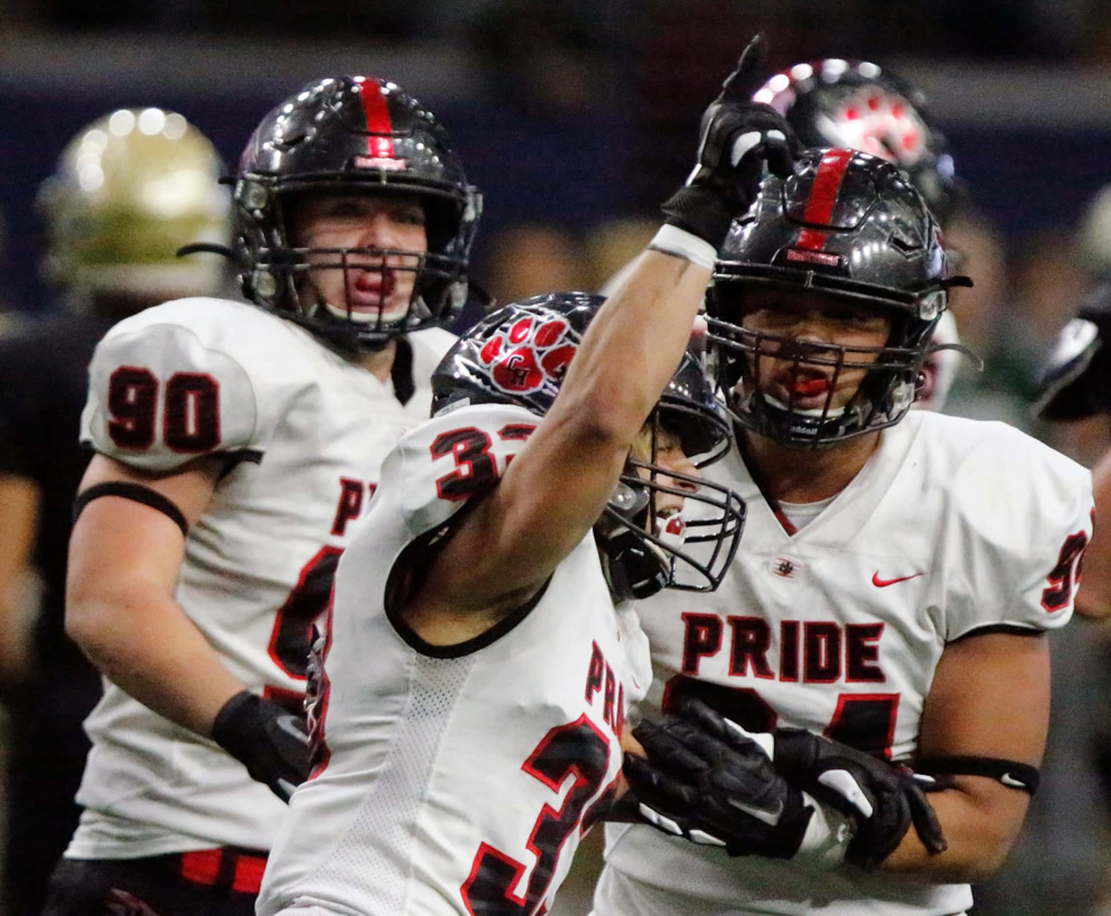 Colleyville Heritage High School linebacker Matthew Powers (33) celebrates a sack with...