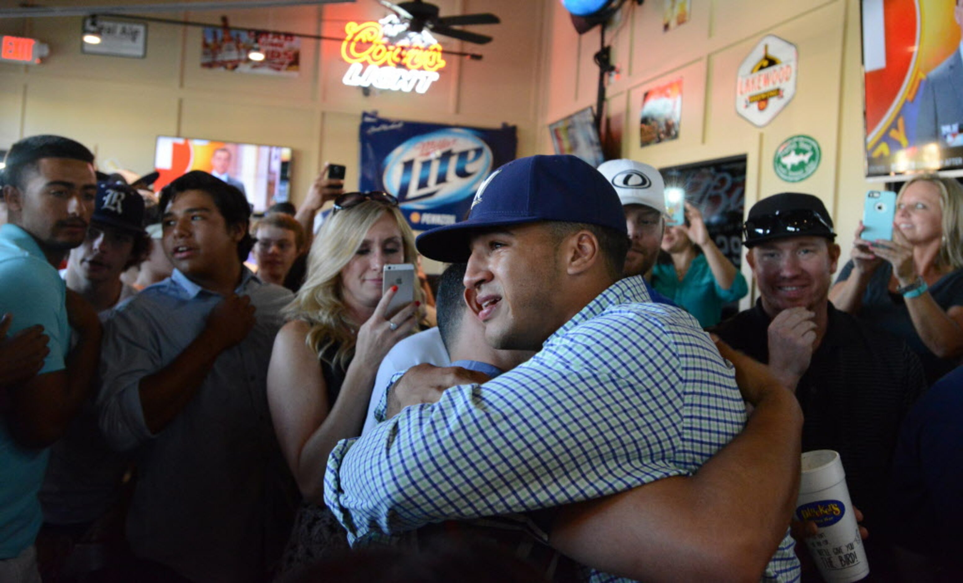 An emotional Trent Clark hugs a friend after being chosen by the Milwaukee Brewers as the...