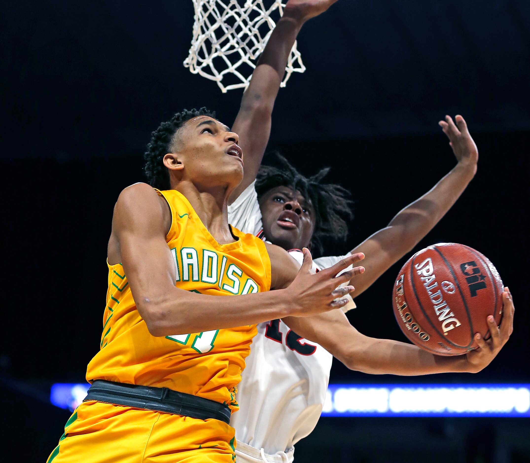 Madison guard Jerome Rogers Jr. #11 drives for two. Madison defeated Coldspring-Oakhurst...