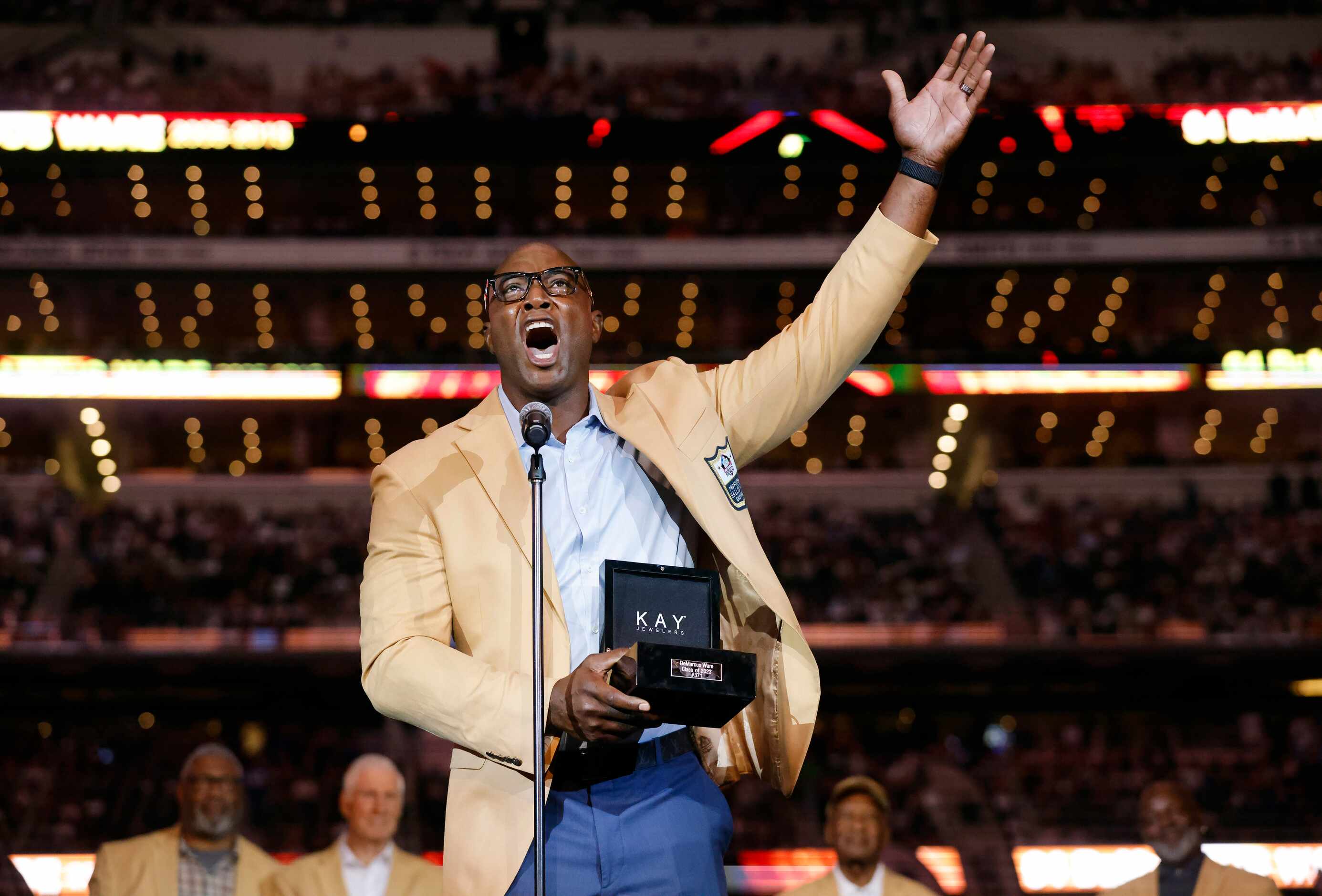Dallas Cowboys Pro Football Hall of Famer DeMarcus Ware speaks to the crowd after e...