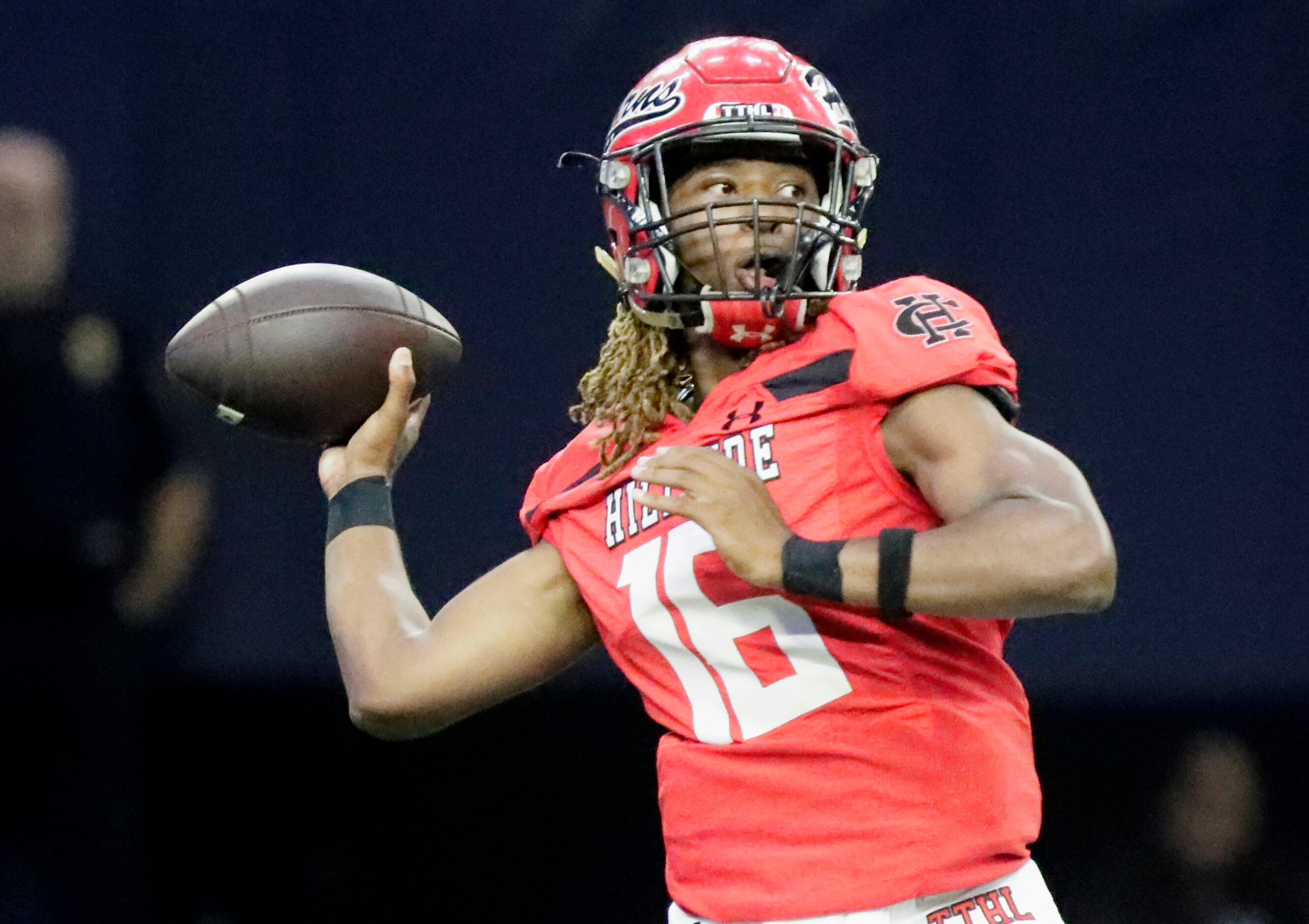 Cedar Hill High School quarterback Jaylon Thomas (16) throws a pass that would be...