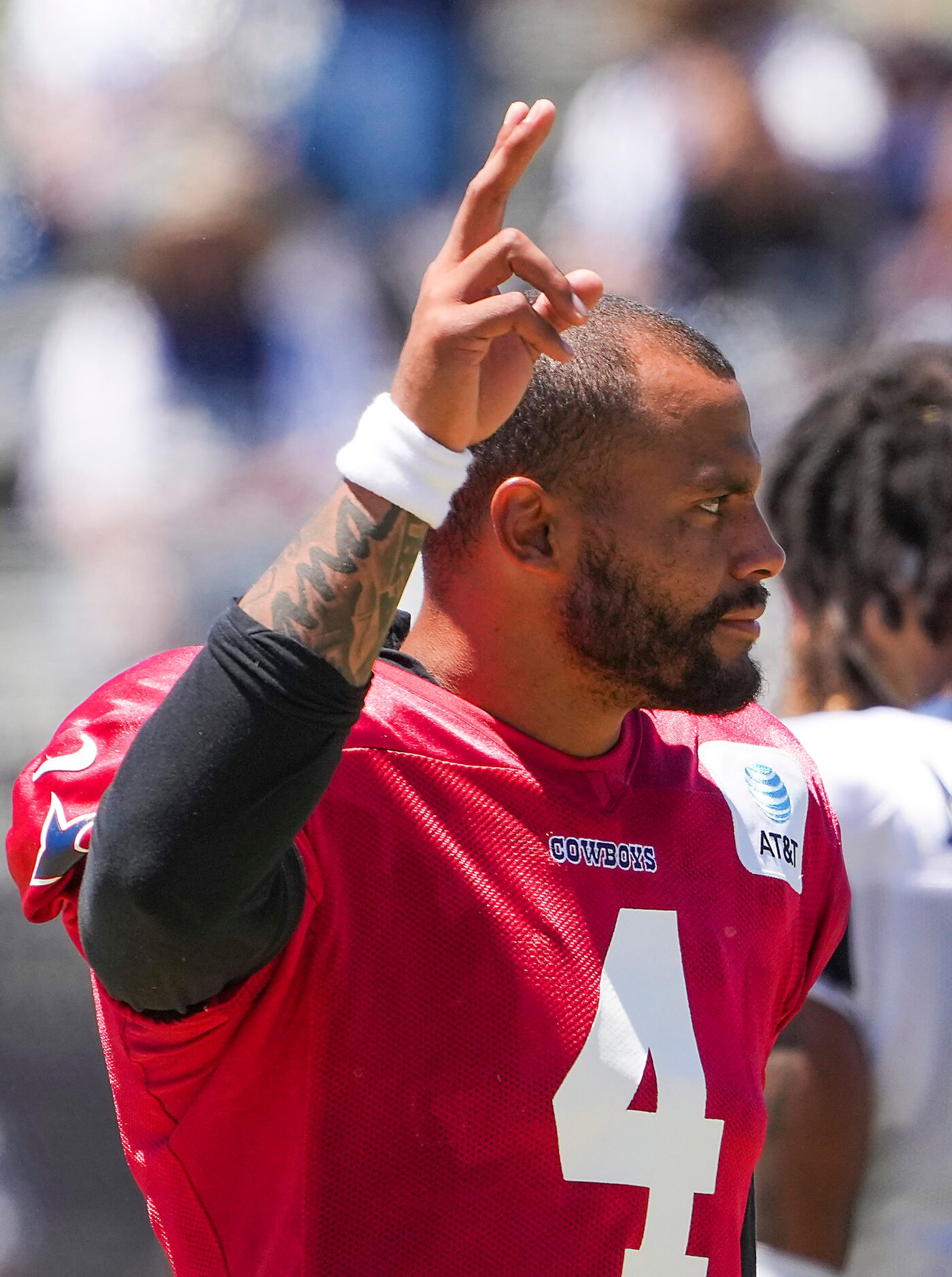 Dallas Cowboys quarterback Dak Prescott (4) waves to fans during a practice at training camp...