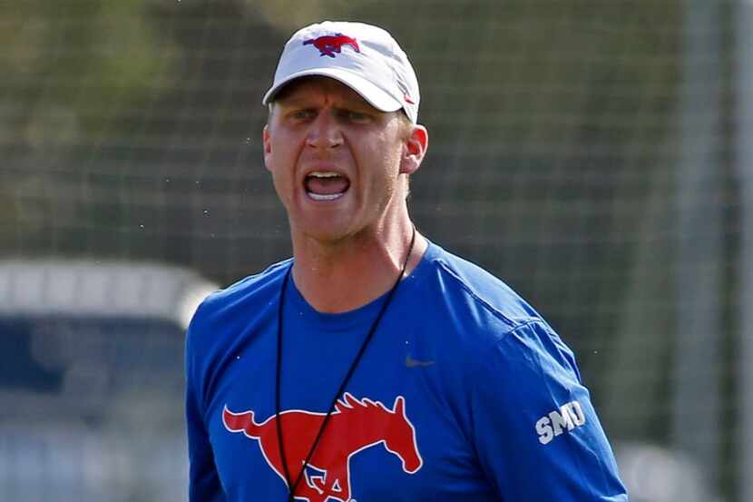 Rhett Lashlee yells during the first spring practice of the season on the campus in Dallas,...