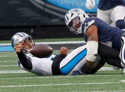 Carolina Panthers quarterback Bryce Young (9) loses a ball after he was tackled by Dallas...