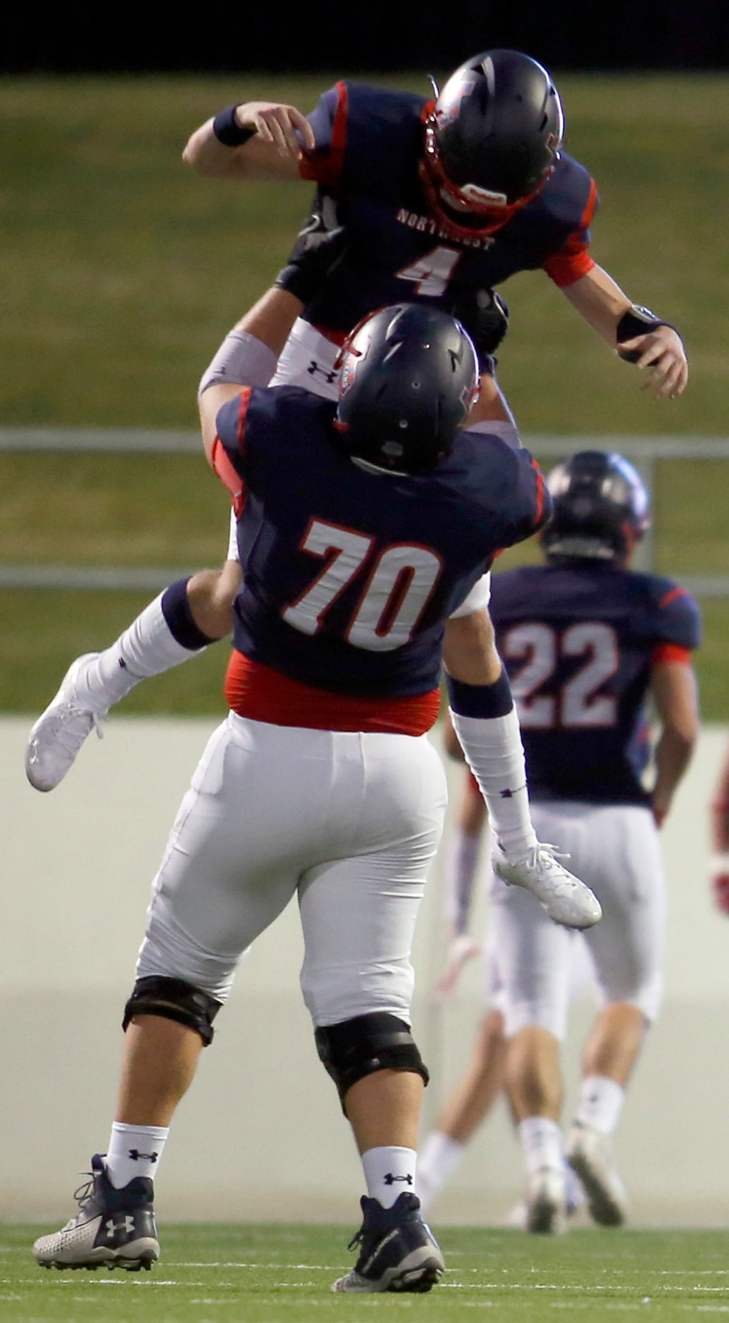 Northwest quarterback Jake Strong (4) celebrates with offensive lineman  Caden Barnett (70)...