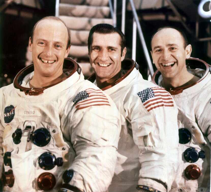 A photo provided by NASA of Alan Bean, right, with his Apollo 12 crewmates, Pete Conrad,...