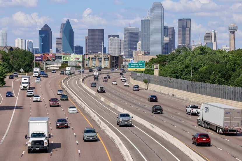 Traffic moves along Interstate 30 near downtown Dallas, Tuesday, June 18, 2024.