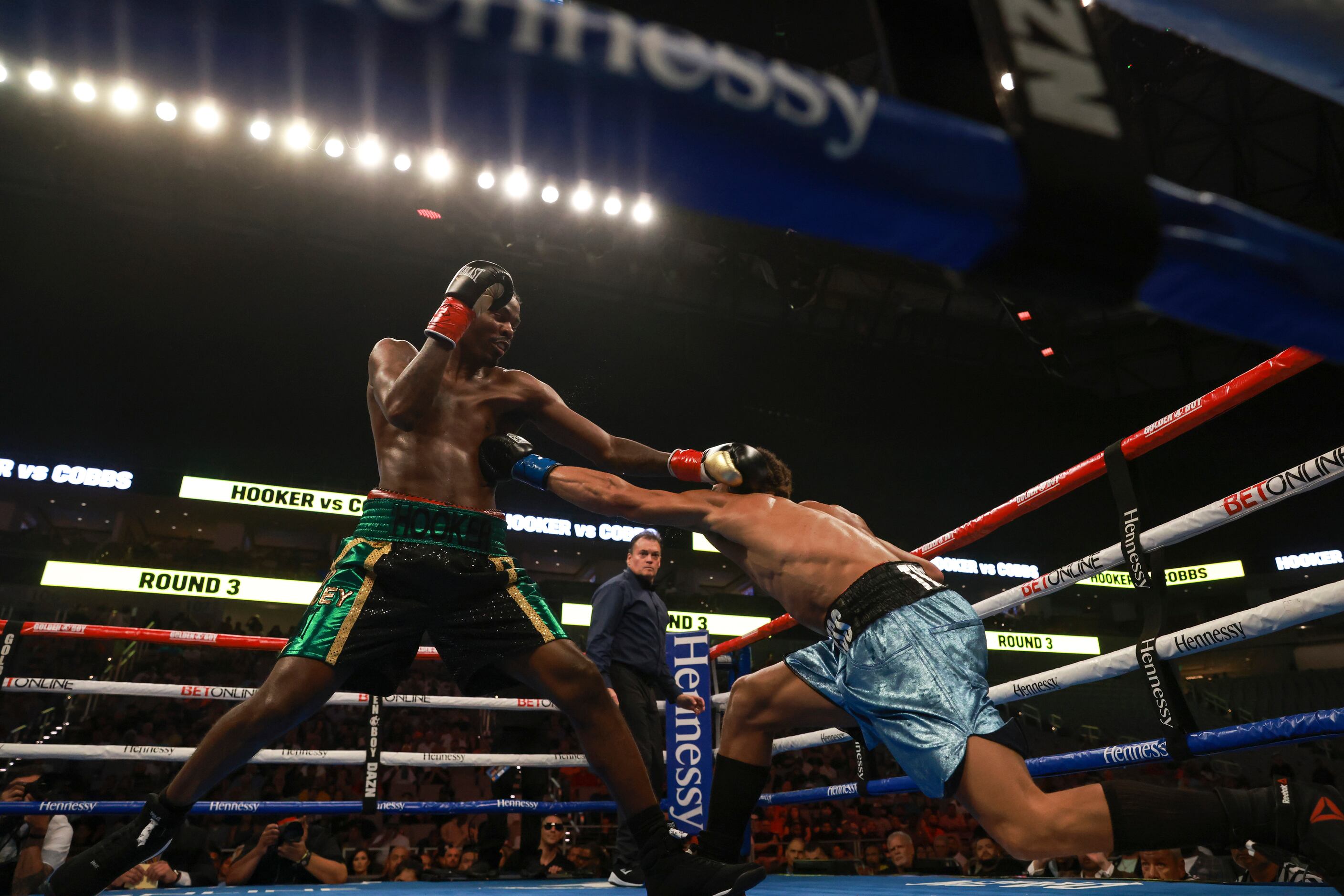 Maurice Hooker and Blair Cobbs throw punches in the third round, Saturday, August 6, 2022,...