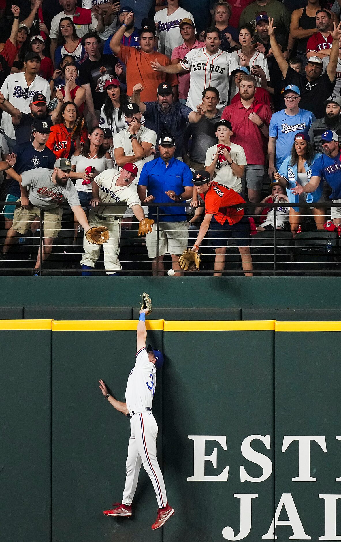 A three-run home run by Houston Astros second baseman Jose Altuve goes over Texas Rangers...