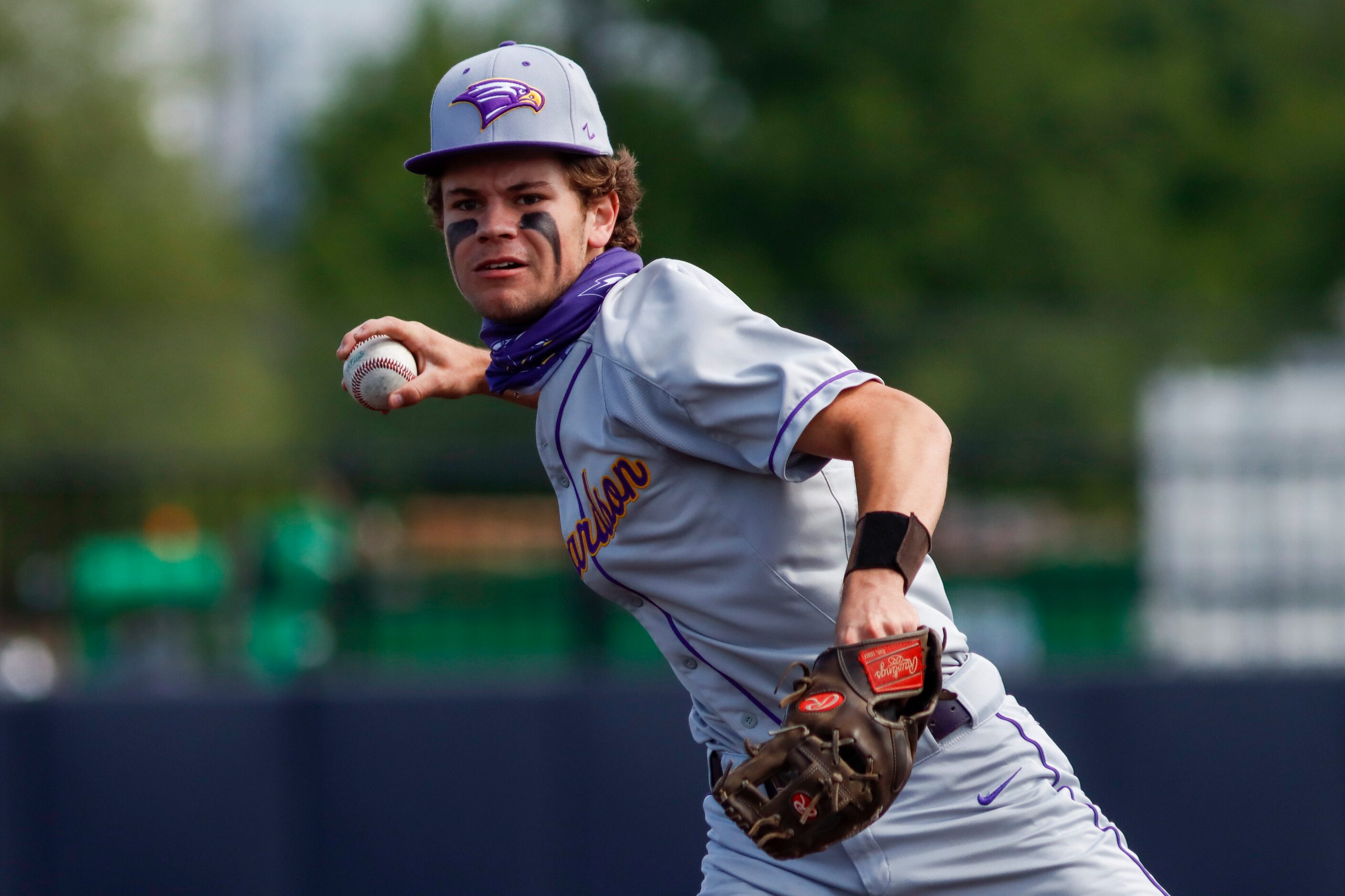 Richardson second baseman Keller Brown throws to first during a district 7-6A game against...