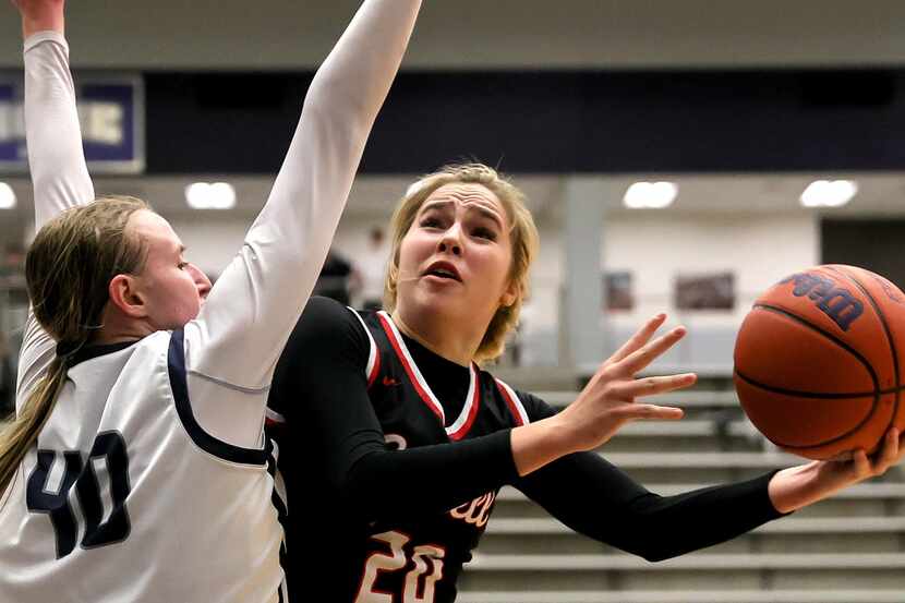 Coppell guard Julianna Lamendola (20) tries to go around Flower Mound guard Madison Cox (40)...