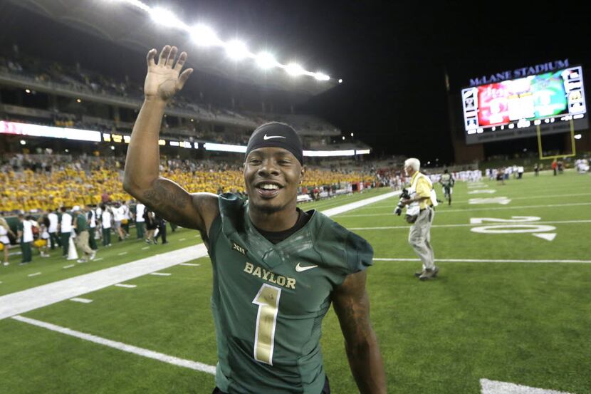 Baylor wide receiver Corey Coleman celebrates on the field after an NCAA college football...