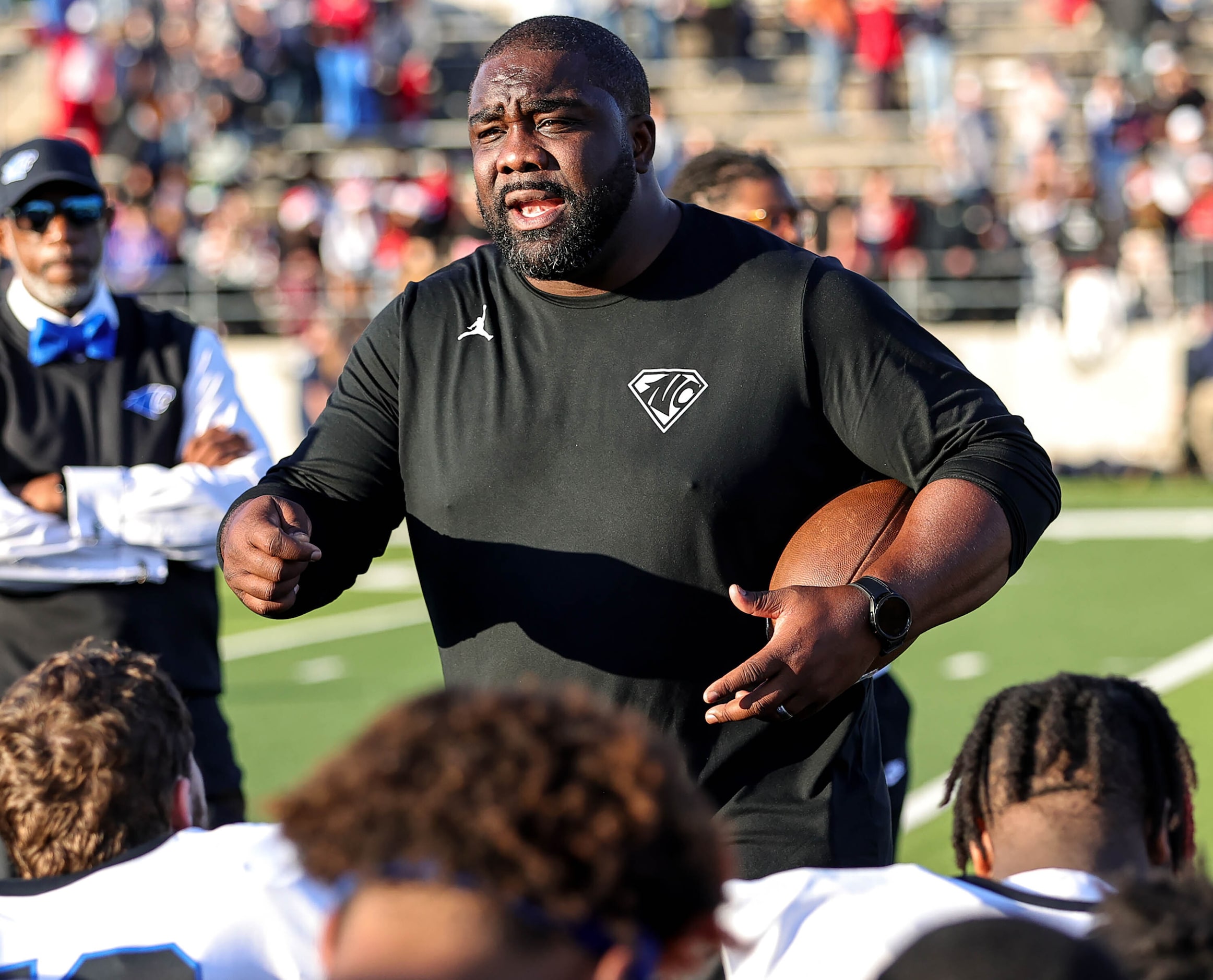 North Crowley head coach Ray Gates talks to his team after beating Allen, 49-37 in the 6A...