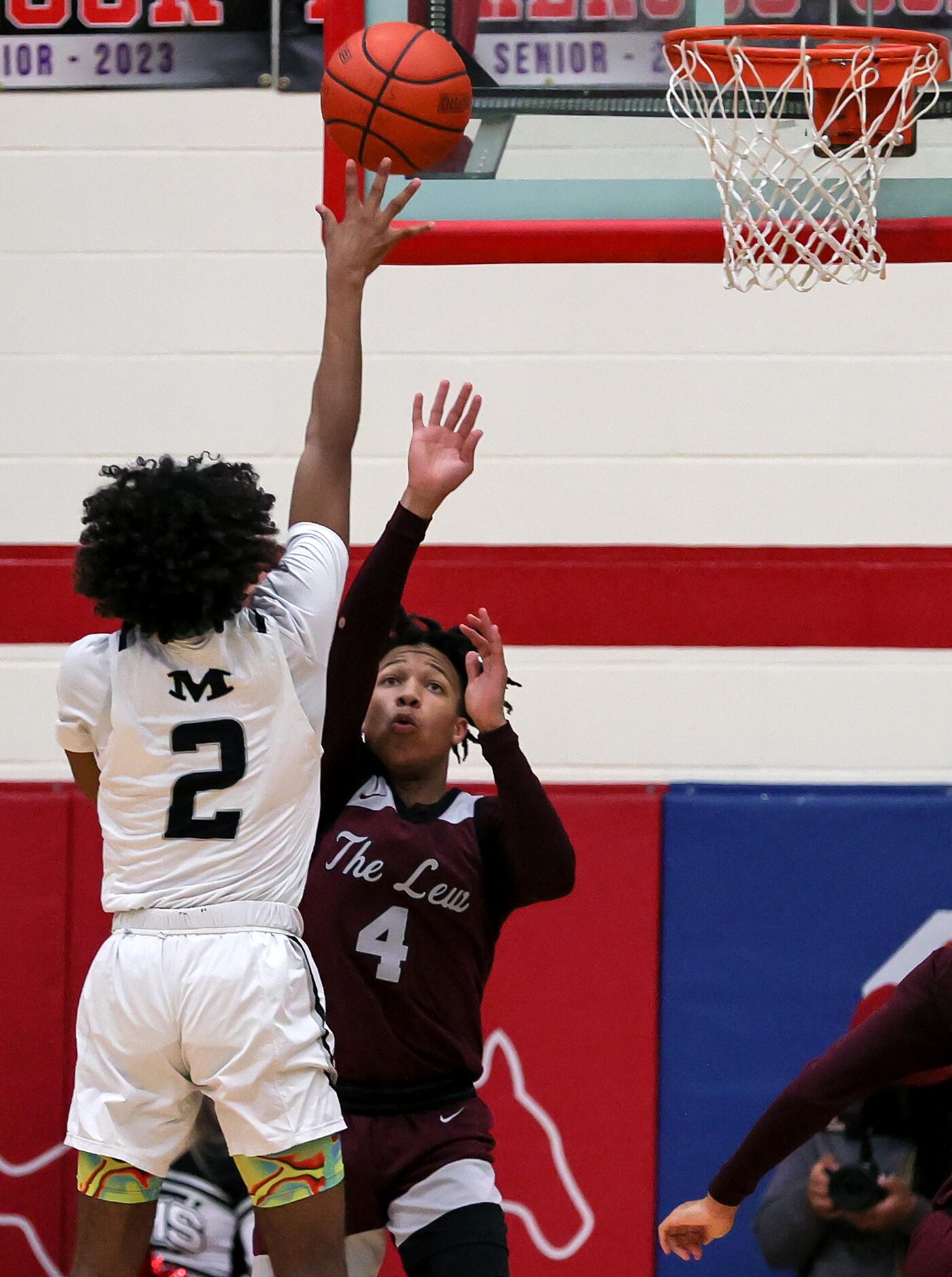 Arlington Martin guard Jaden Juarez (2) puts up a shot over Lewisville guard Rakai Crawford...