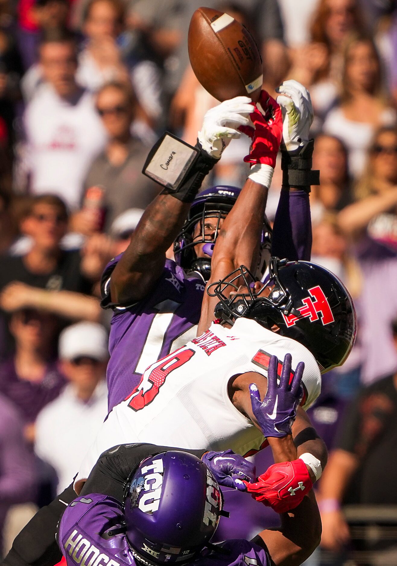 TCU safety Abraham Camara (14) breaks up a pass intended for Texas Tech wide receiver Loic...