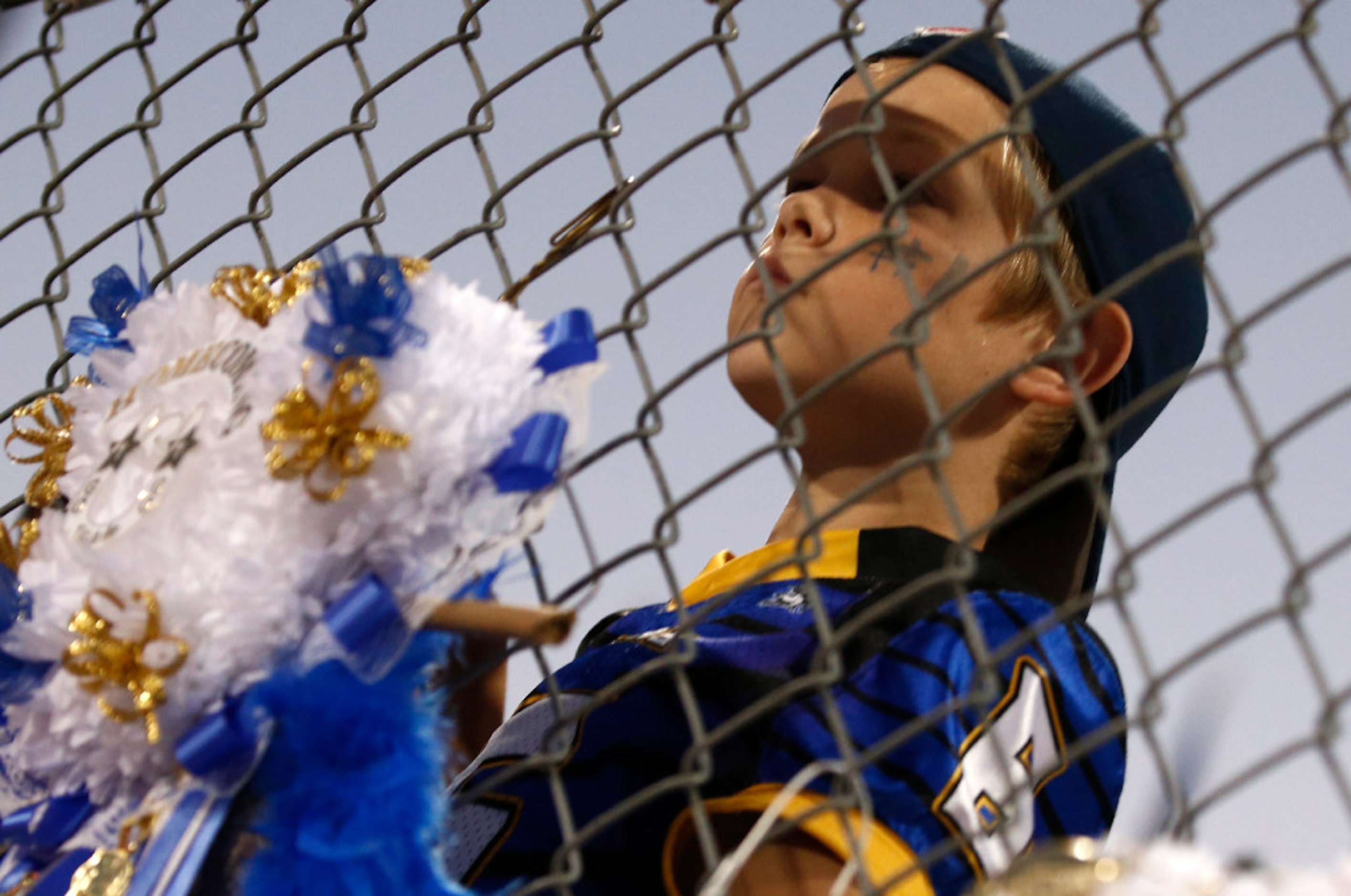 Paul Griffin, age 9 of Sunnyvale, watches the homecoming festivities before the high school...