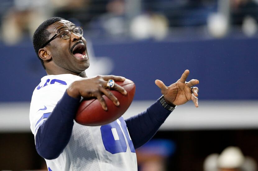 FILE — Dallas Cowboys former receiver Michael Irvin (88) plays catch with himself after...