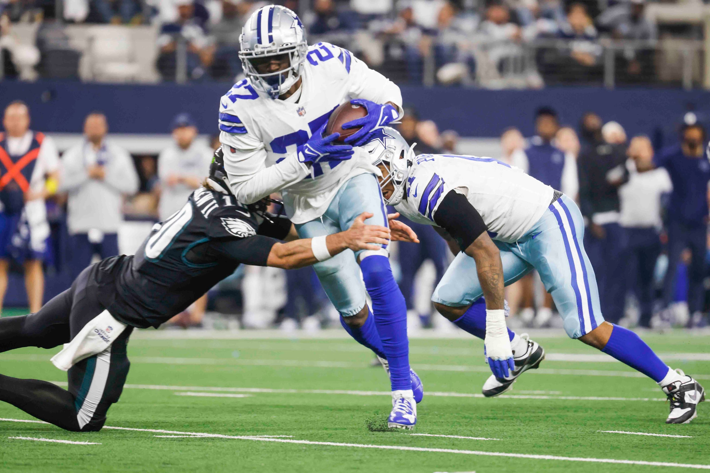 Dallas Cowboys safety Jayron Kearse (27) gets tackled by Philadelphia Eagles quarterback...