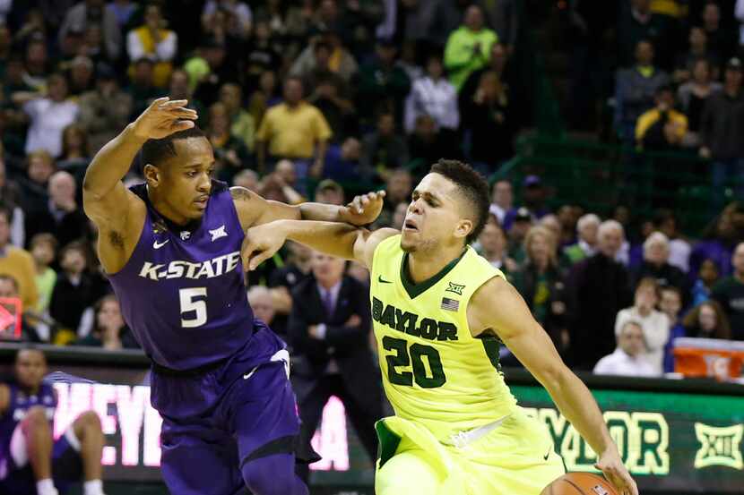 Baylor guard Manu Lecomte, right, drives against Kansas State guard Barry Brown, left, in...