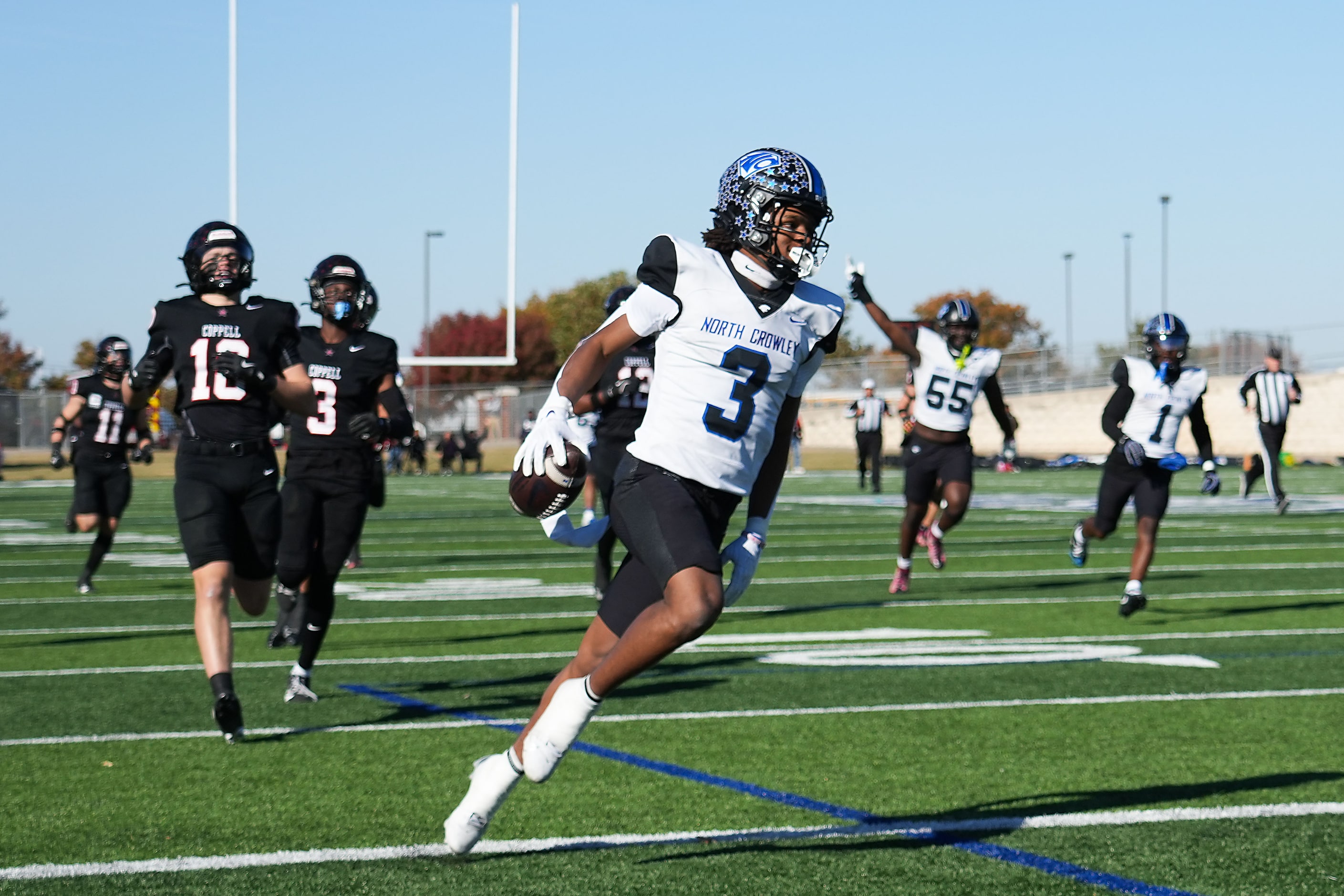 North Crowley wide receiver Kevin Moore (3) scores on a 75-yard touchdown reception from...