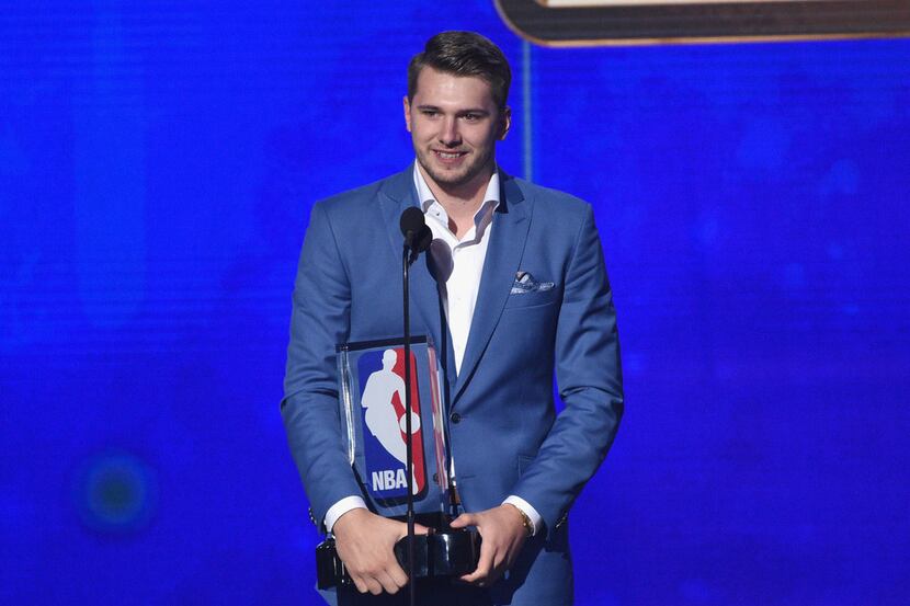 Luka Doncic, of the Dallas Mavericks, accepts the NBA rookie of the year award at the NBA...
