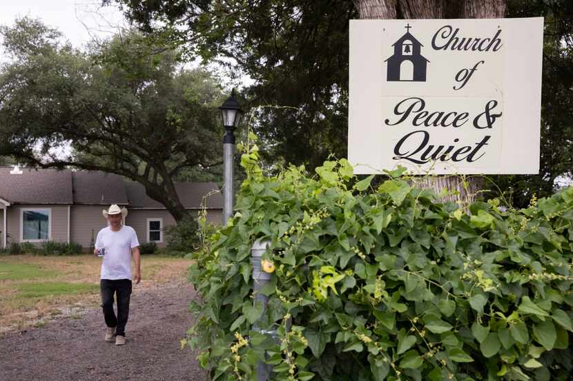 A sign for the Church of Peace & Quiet at Neil Foreman’s  home in Unincorporated Tarrant...