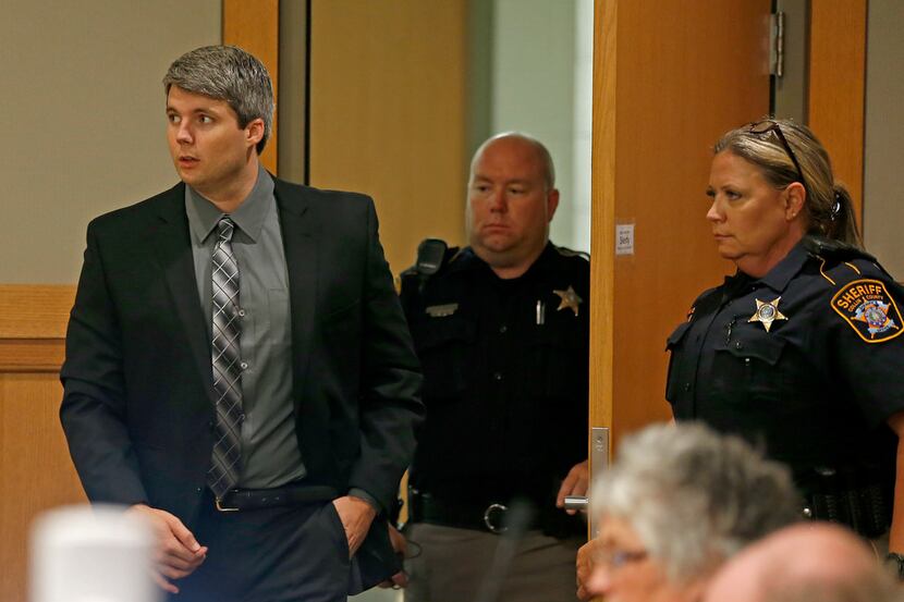 Defendant Jason Lowe (left) enters a courtroom during his murder trial in the death of...