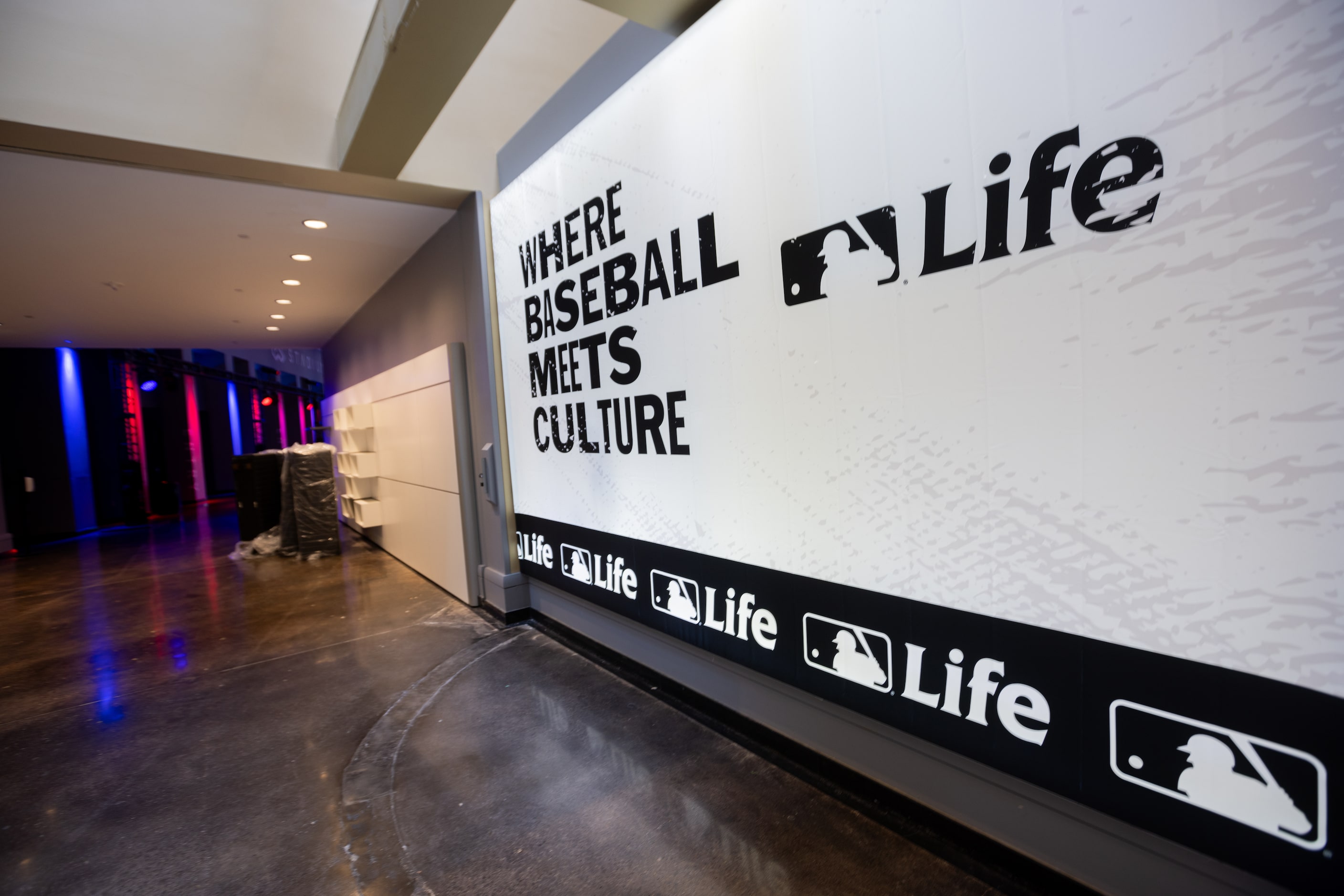 An MLB Life banner at the MLB's All-Star Village installation at the Esports Stadium...