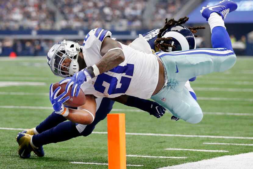 Dallas Cowboys running back Ezekiel Elliott (21) dives across the goal line for a second...