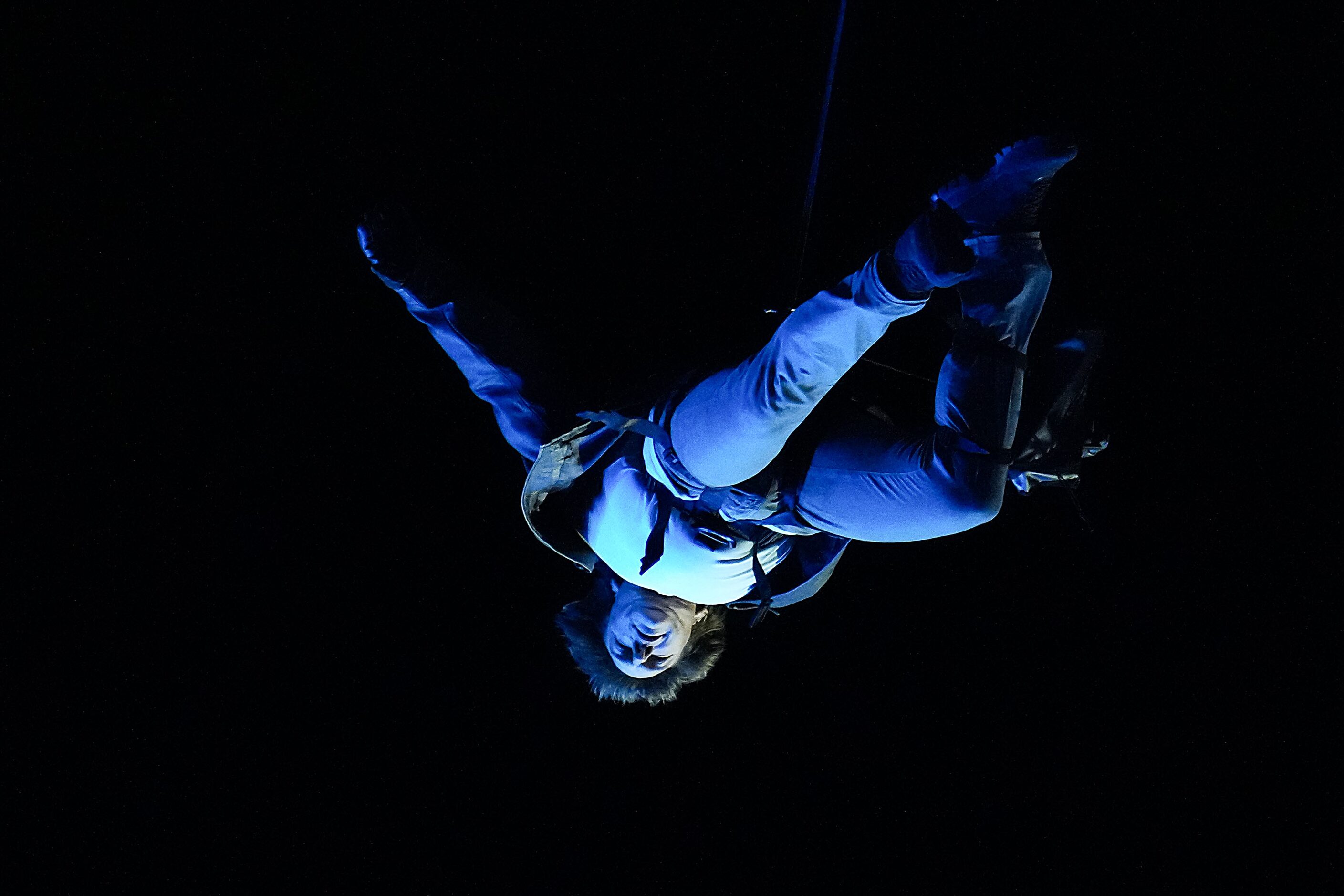 Actor Tom Cruise is lowered from the roof of the stadium into the Stade de France during...