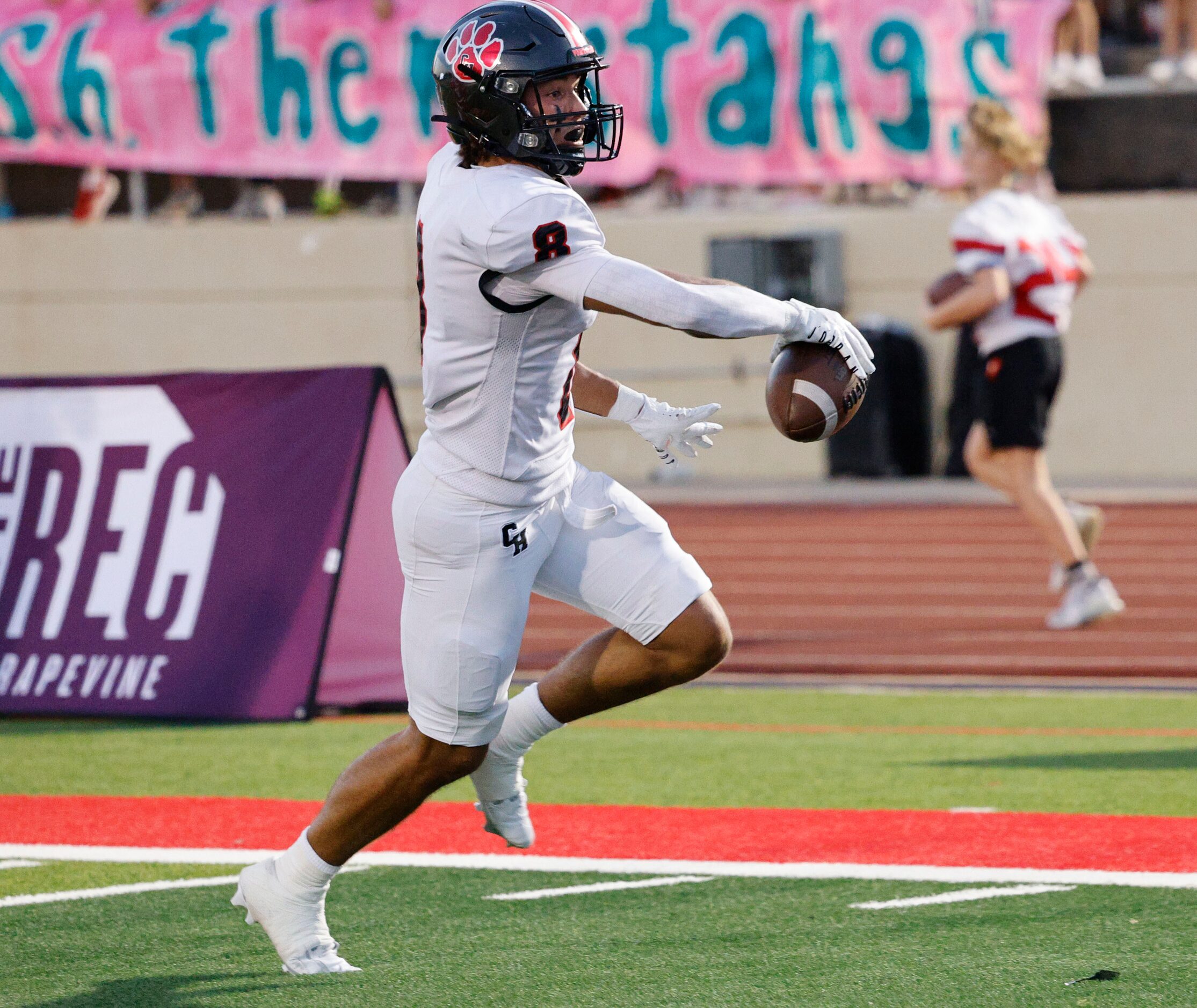 Colleyville Heritage's Braden Blueitt (8) runs into the end zone for a touchdown during the...