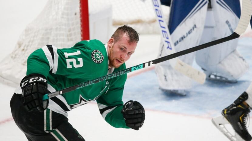 Dallas Stars center Radek Faksa (12) skates to the bench after losing his helmet during the...