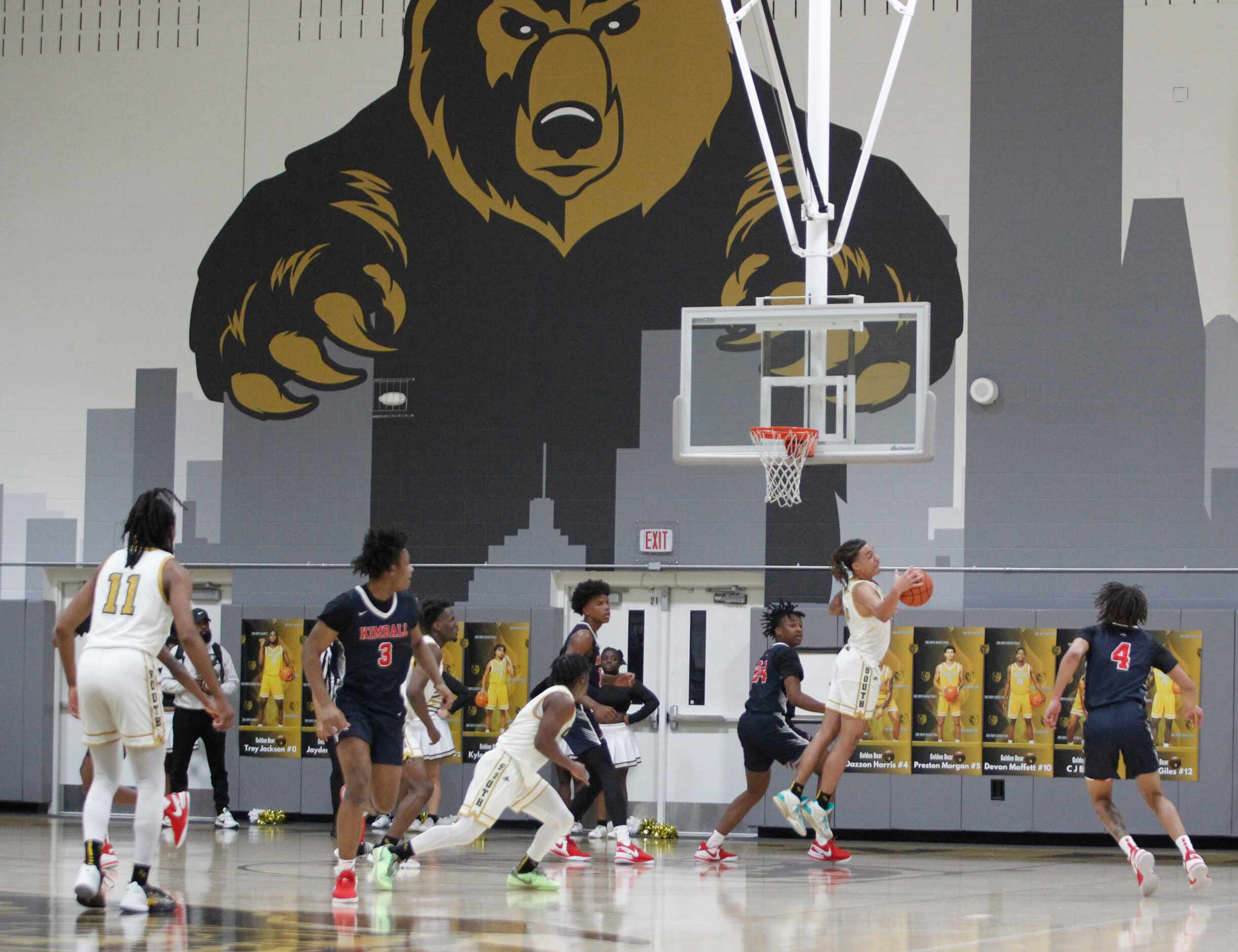 South Oak Cliff's Dazzon Harris (4), leaps to pull in an offensive rebound during first half...