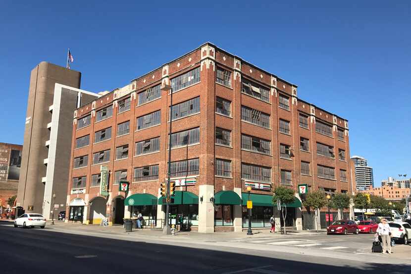 The 711 Elm Street building was constructed as a parking garage in 1925 for the Sanger...