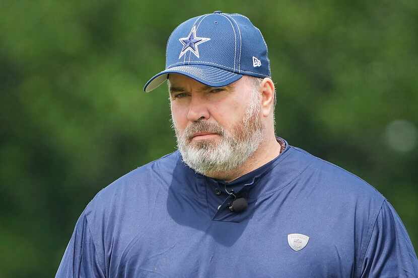Dallas Cowboys head coach Mike McCarthy gives a thumbs up as he watches his team run drills...