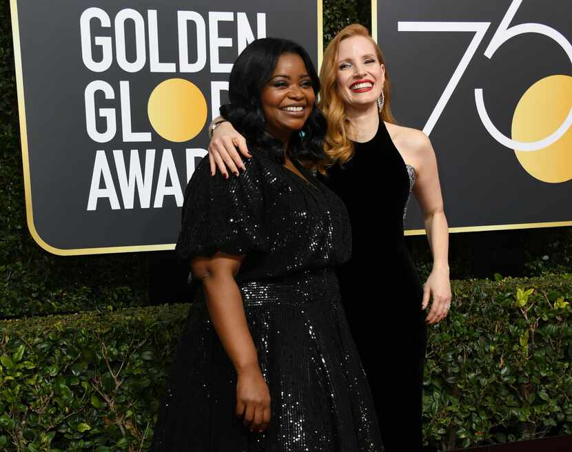 Actresses Jessica Chastain (R) and Octavia Spencer arrive for the 75th Golden Globe Awards...